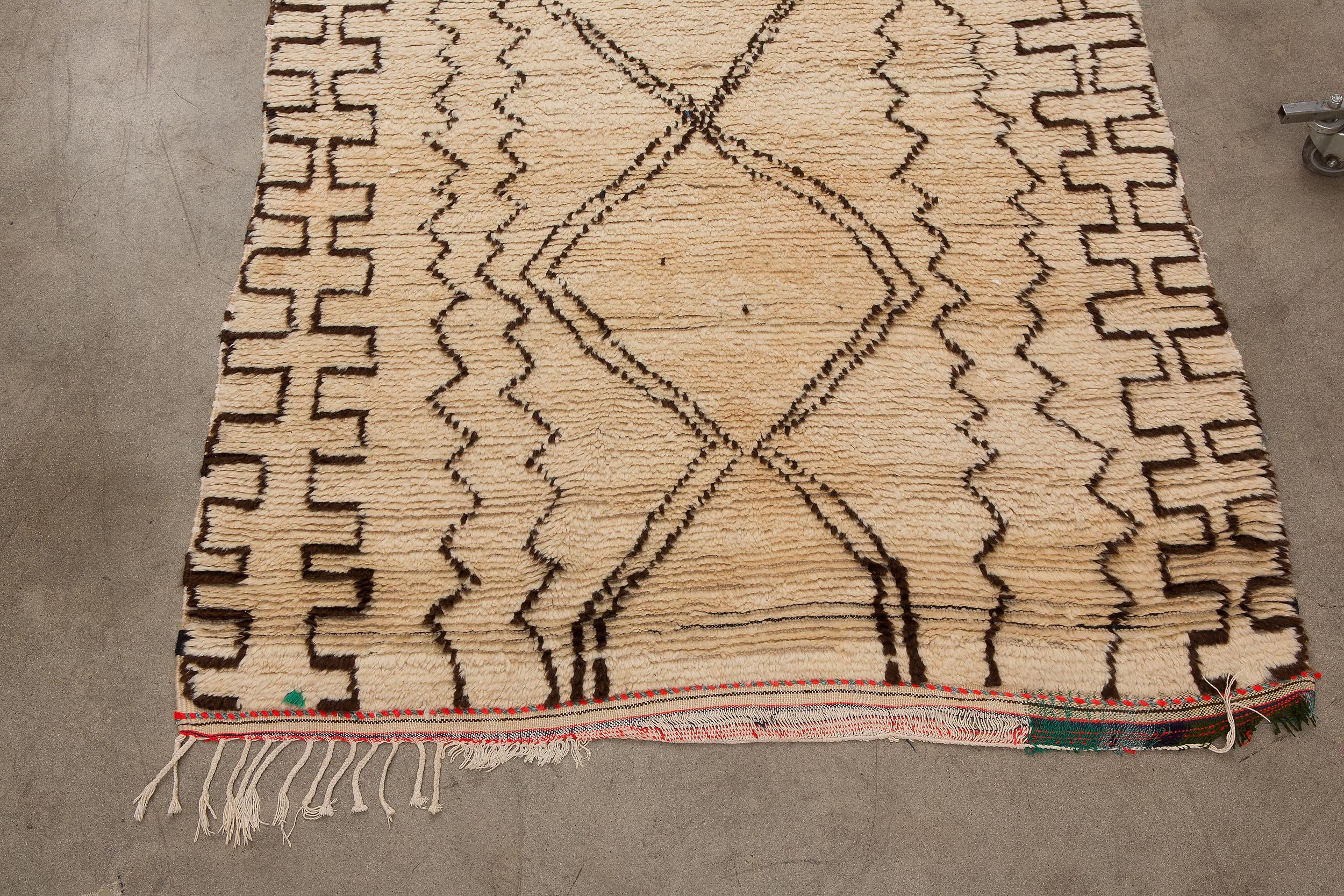 Azilal rugs are known for their artistic, abstract and avant-garde style of weaving. Being single-knotted allows for finer work and design. Often made from silky un-dyed sheep’s wool with a neutral ivory base, utilizing brown or black wool to create