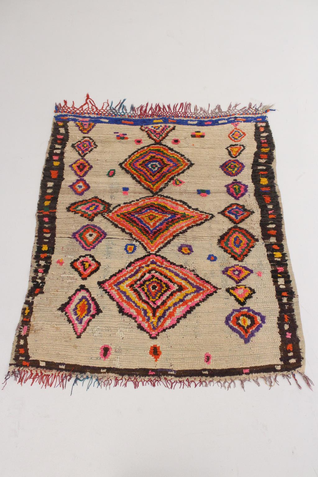 I selected this beautiful rug from piles of carpets as I have always loved a vintage, artful Azilal rug with traditional berber designs! Background of this one is a beige with unregular, colorful diamonds series in pink, red, blue, yellow, orange...