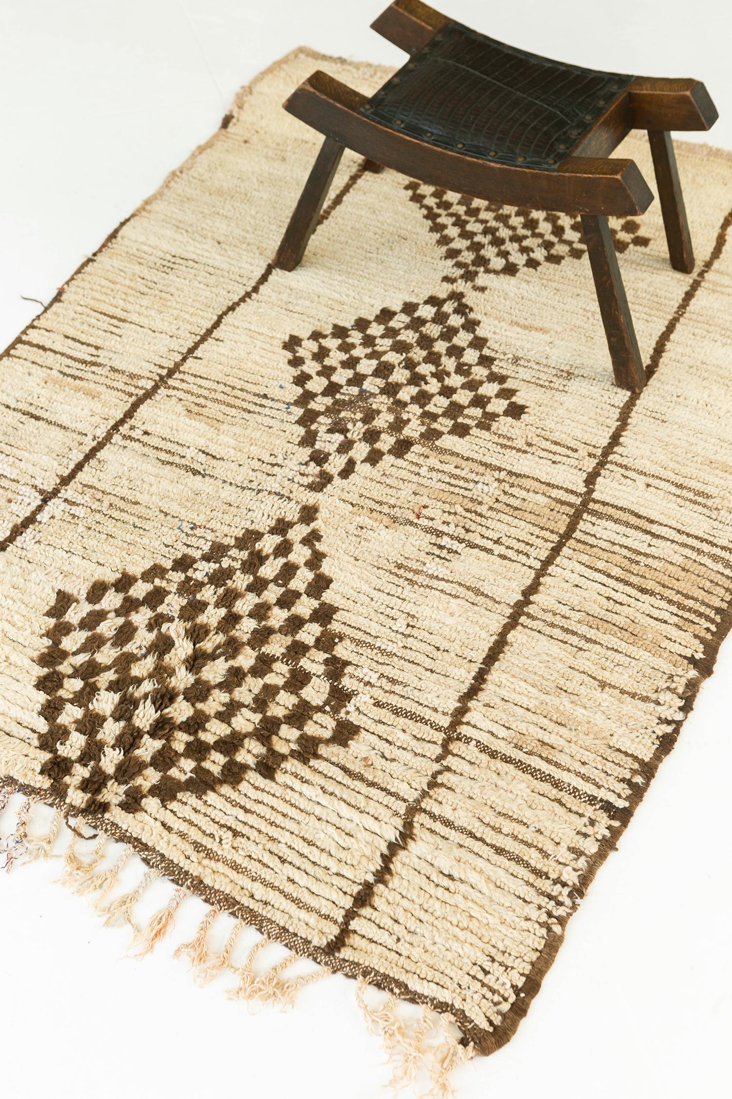 Ivory and pale tan pile field with dark brown checkerboard diamonds and vertical line elements. The foundation is multi-toned with broad bands of ivory and brown highlighting horizontal lineation between rows of knots in portions of the rug. A