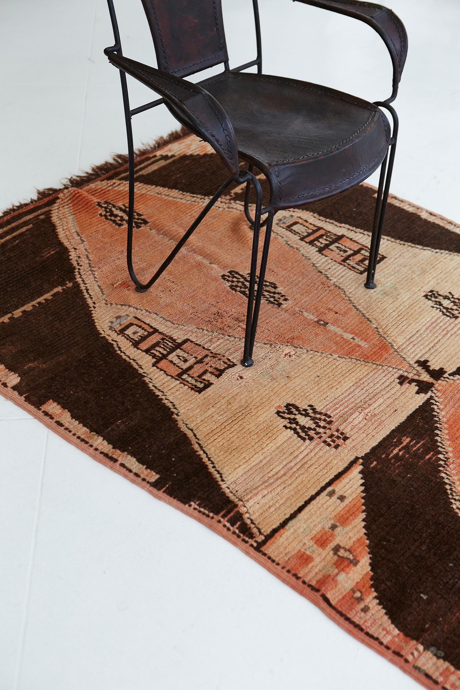 A boldly ornamented vintage Moroccan Azilal Tribe Berber rug with marigold accents in an abrashed textured field. Displaying the rug’s prayer rug formation, which signifies beauty in the Moroccan tradition, this majestic rug gives a sense of
