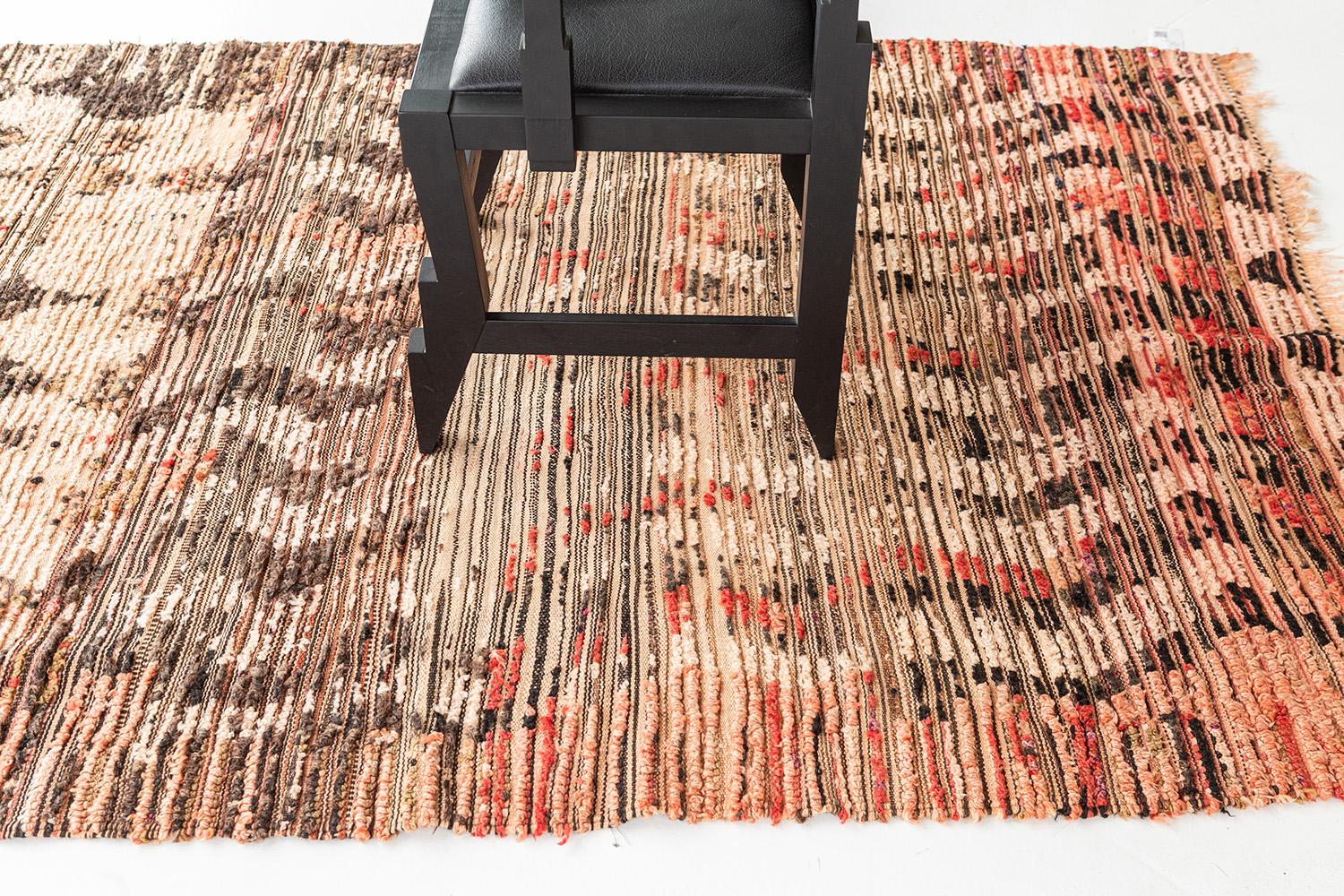 Adding this up to your collection will make your guests in awe. This vintage Berber Rug features one of the stories of Azilal Tribe handwoven in clay-tone wool. It makes it more unique when lozenges, zigzag, crisscross, and ambiguous Berber symbols