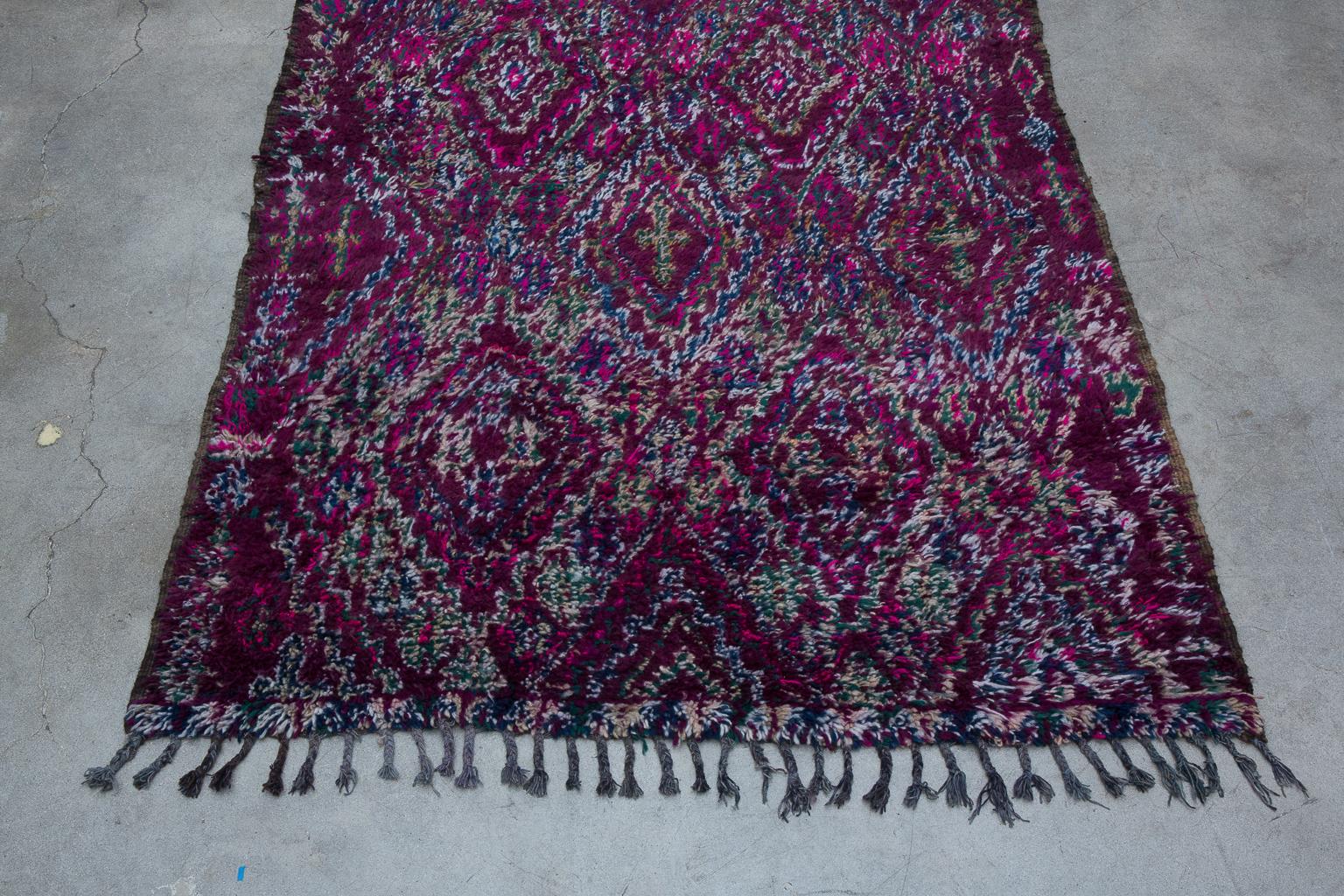 The Beni M'Guild tribe yields from the middle atlas region of Morocco. Beni M'Guild rugs tend to be very plush, woven to provide warmth and comfort during the winter months. They are known for utilizing indigo to create deep shades of blue and