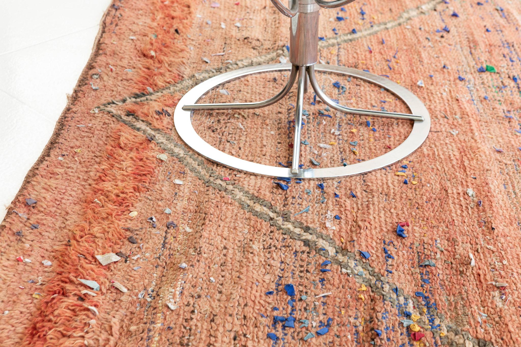 Featuring the most sought after clay palette, this breath-taking Morrocan rug made from hand-spun wool will certainly captivate every stylish mind. The fish symbol featured in this masterful design will exude sophistication as an effect of