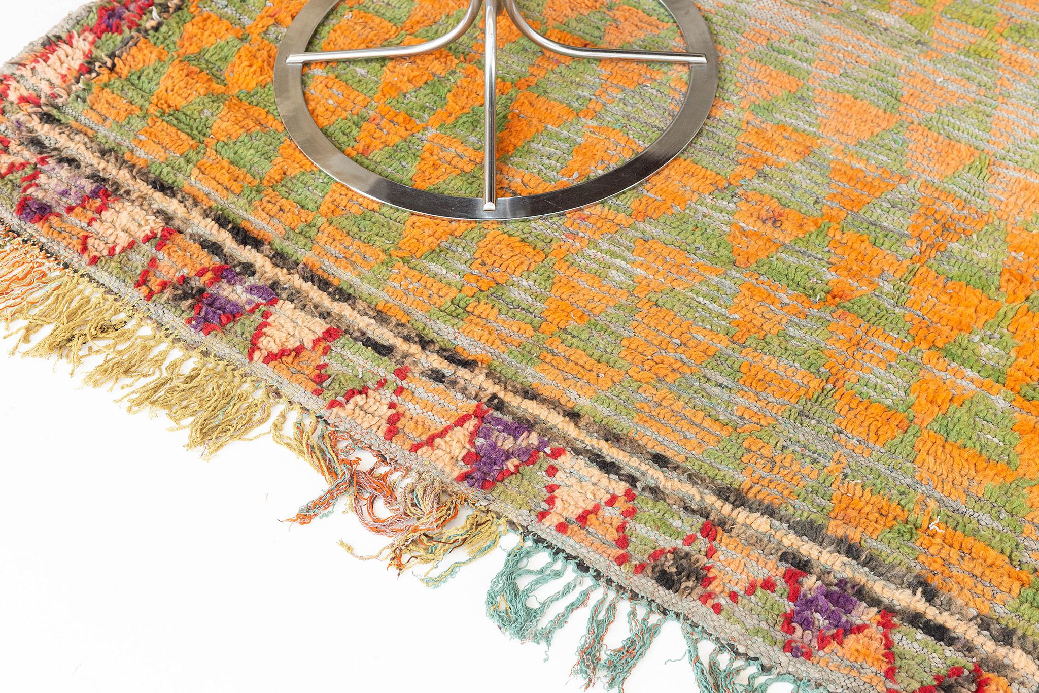 This magnificent Beni M'Guild Tribe design consists of diamond motifs and triangular patterns. That each pattern telling the story of their tribe in a colorful scheme. A centerpiece that is perfect addition to your collection.

Rug