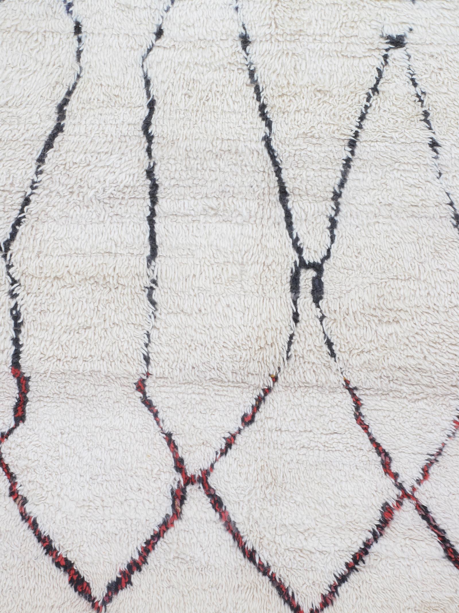 Our vintage Moroccan rugs are part of a skillfully curated collection of rare and unusual designs. They are made of all-natural dyes and 100% handspun wool from the Atlas Mountain region in North Africa. These rugs are all one of kind as they were
