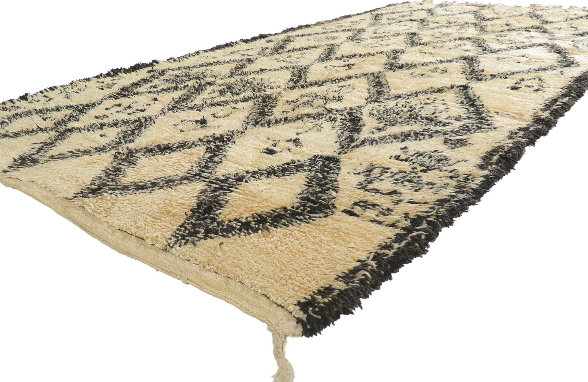21357 Vintage Moroccan Beni Ourain Rug, 06'00 x 11'05. With its simplicity, plush pile and tribal style, this hand knotted wool vintage Berber Beni Ourain Moroccan rug is a captivating vision of woven beauty. It features a diamond lattice composed