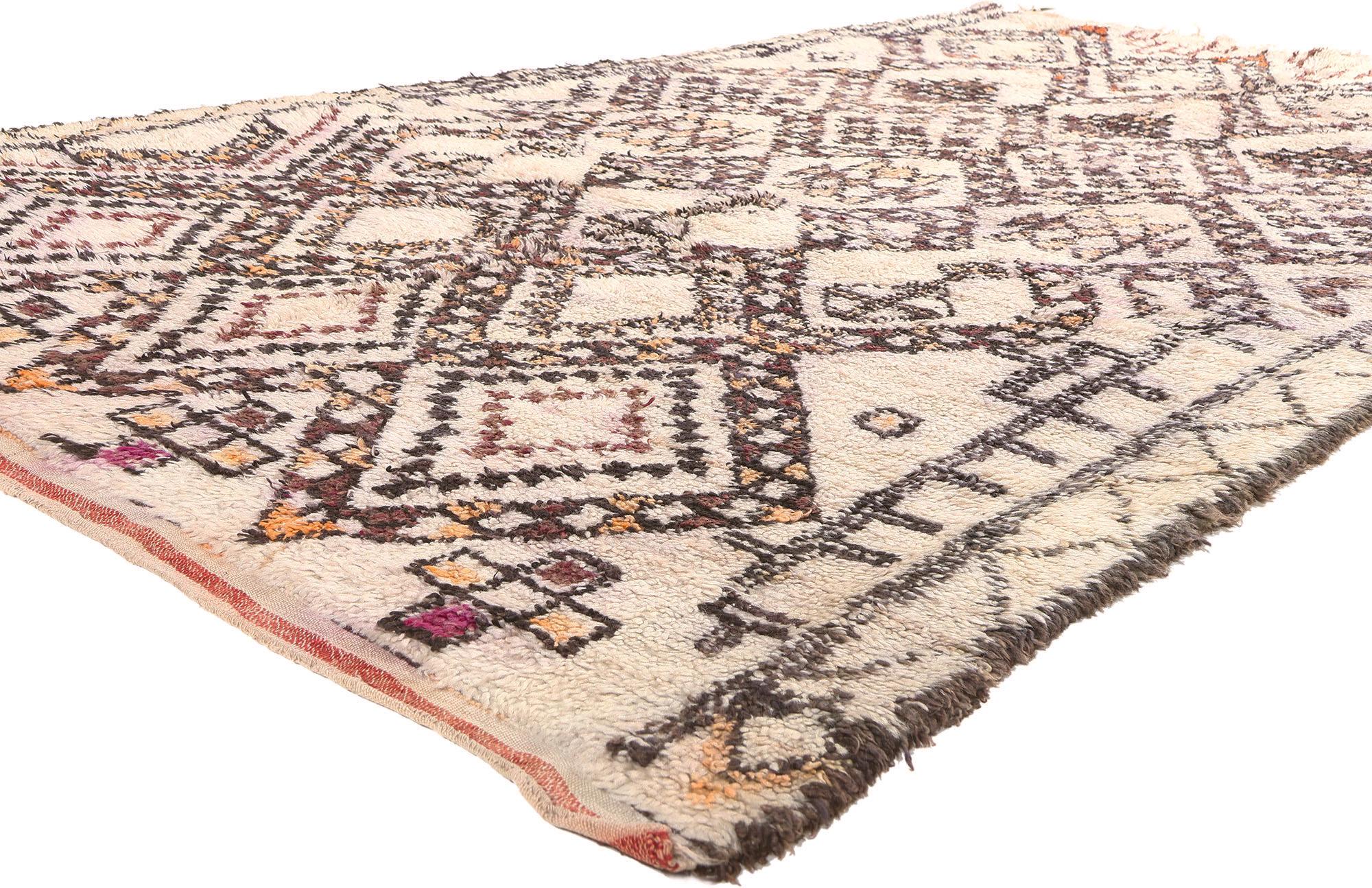 20858 Vintage Moroccan Beni Ourain Rug, 05'09 x 09'05.
This vintage Moroccan rug hails from the Beni Ourain tribe, an integral part of the broader Berber ethnic group in Morocco. Meticulously crafted from natural, undyed sheep's wool, these rugs are
