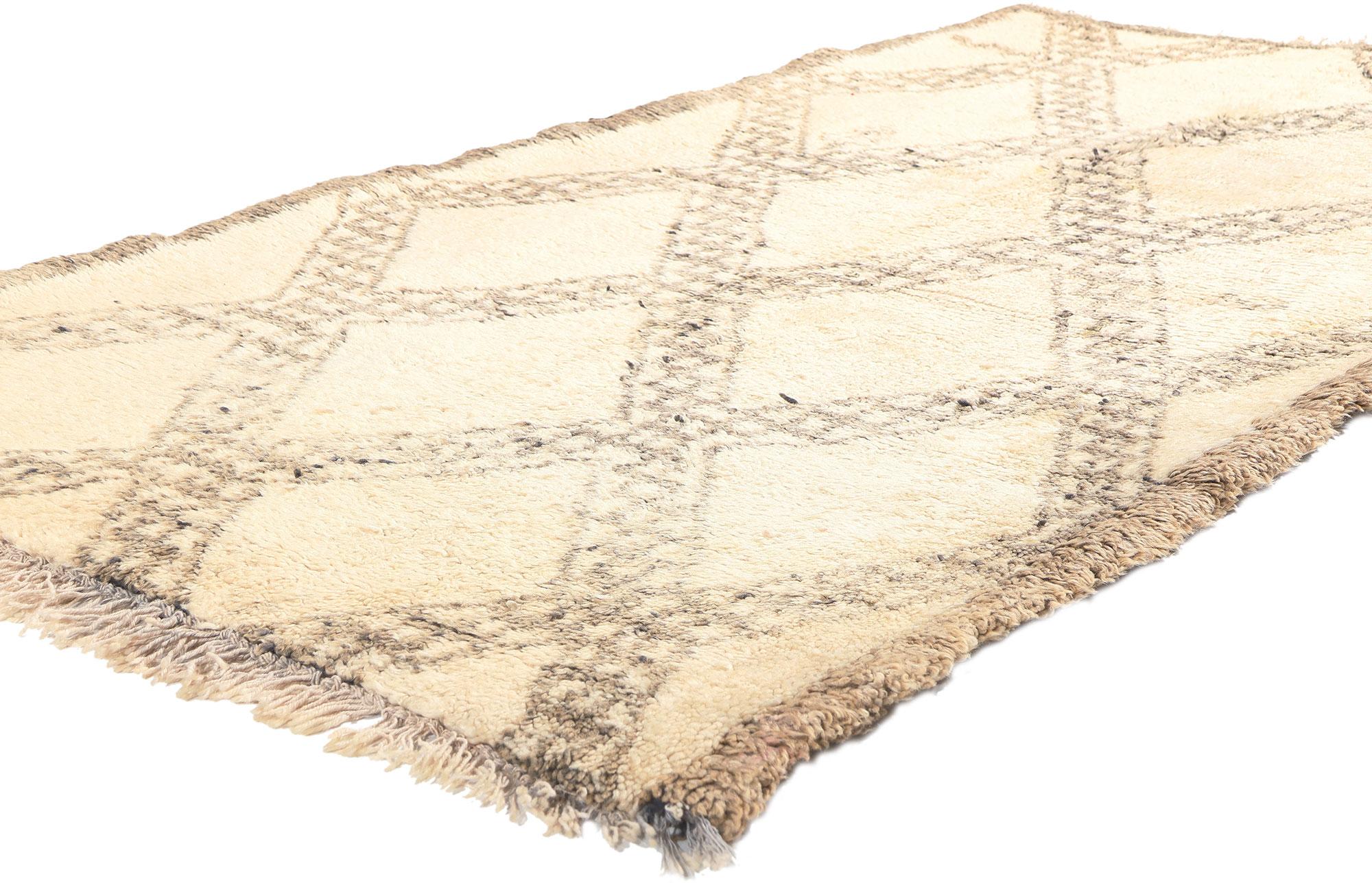 20224 Vintage Moroccan Beni Ourain Rug, 03'04 X 06'02.
Nomadic charm meets modern Bauhaus style in this hand-knotted wool vintage Moroccan Beni Ourain rug. The detailed diamond trellis design and neutral earth-tone colors woven into this piece work