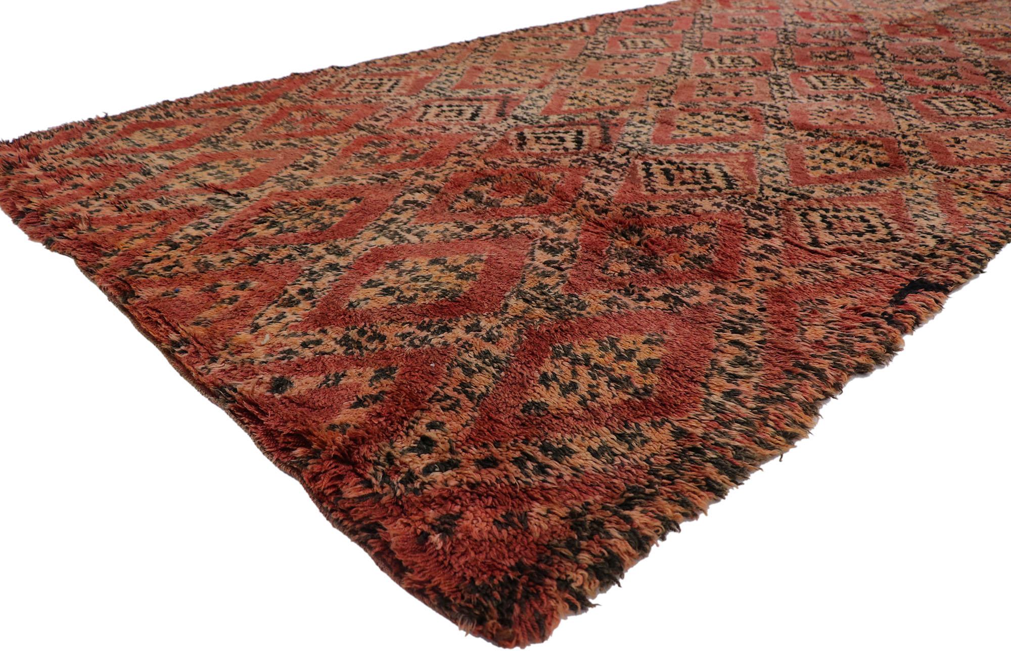 21263 Vintage Moroccan Beni Ourain Rug, 05'10 x 12'03.
Warm worldy charm meets modern desert in this hand-knotted wool vintage Moroccan Beni Ourain rug. The visual complexity and spicy earth-tones woven into this piece work together creating a