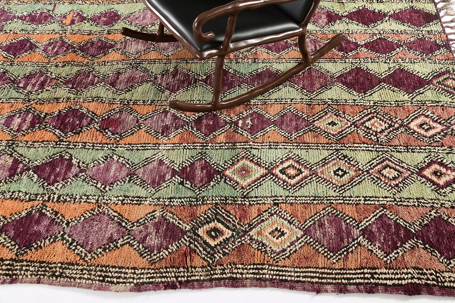 Emanating vibrant character, this inviting Vintage Moroccan Beni Ourain Berber rug provides an engaging design and aesthetic lively color scheme. It features a pattern of X motifs forming series of lozenge trellis running in the alternating lengths