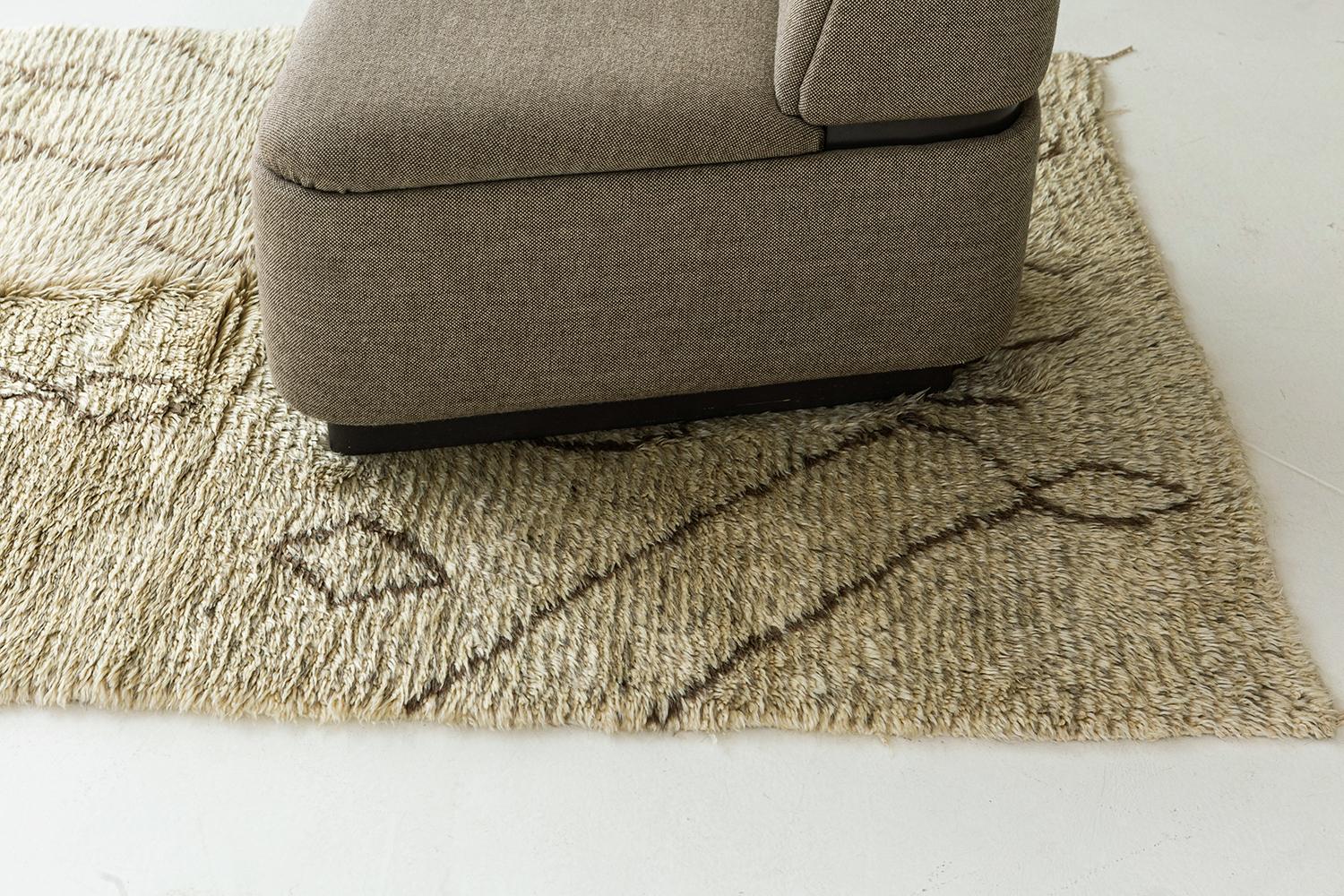 An interesting creation of Beni Ourain Moroccan rug that features the culture of Moroccan Tribes through ambiguous Berber motifs. Clay outlines and cream field are perfect for any space with contemporary interiors that will accent your home