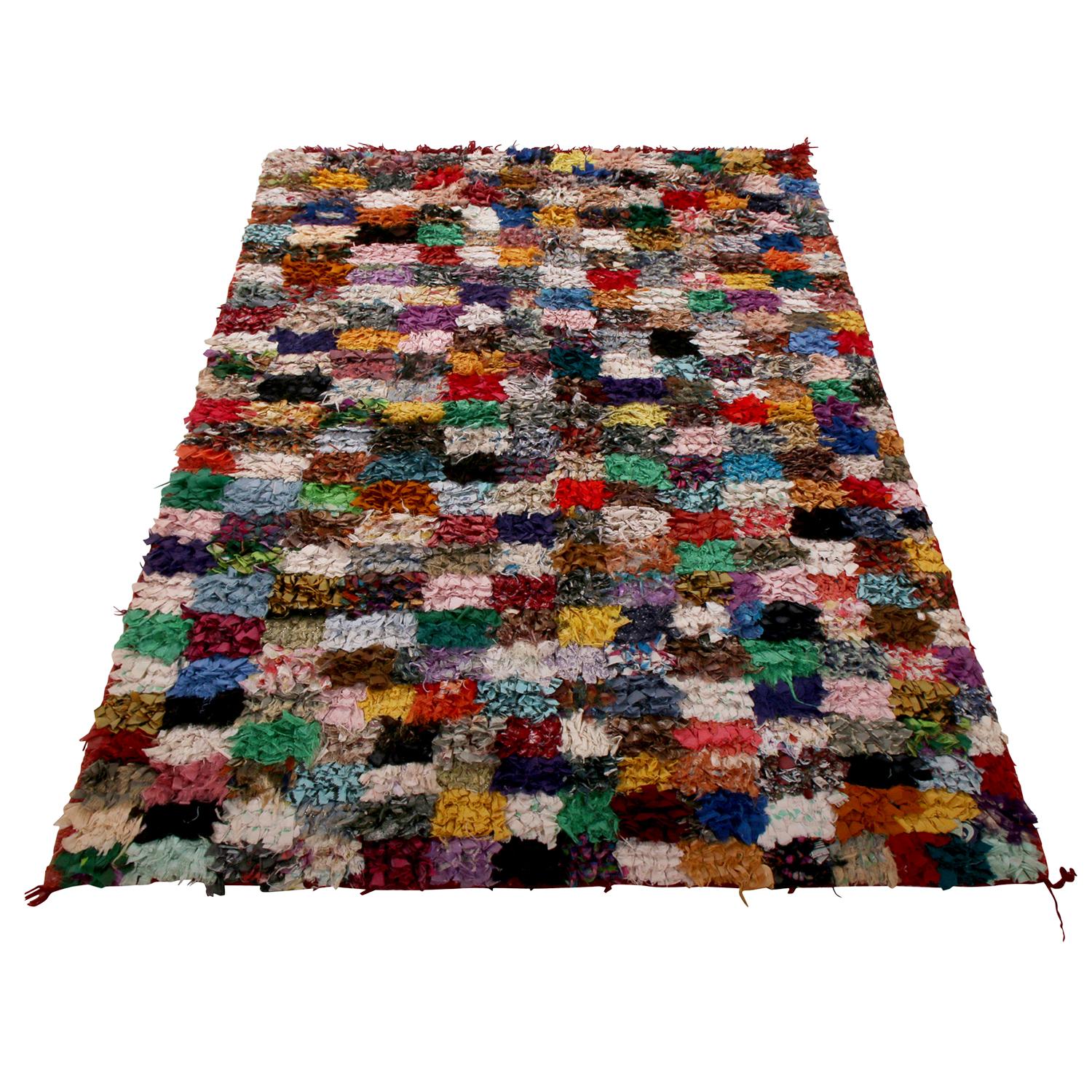 Hand knotted in textural, durable fabric originating between 1950-1960, this vintage Moroccan Berber rug enjoys the idyllic play of geometry and color celebrated among the ancestral tribal weavers responsible for its beauty in this lineage. The very