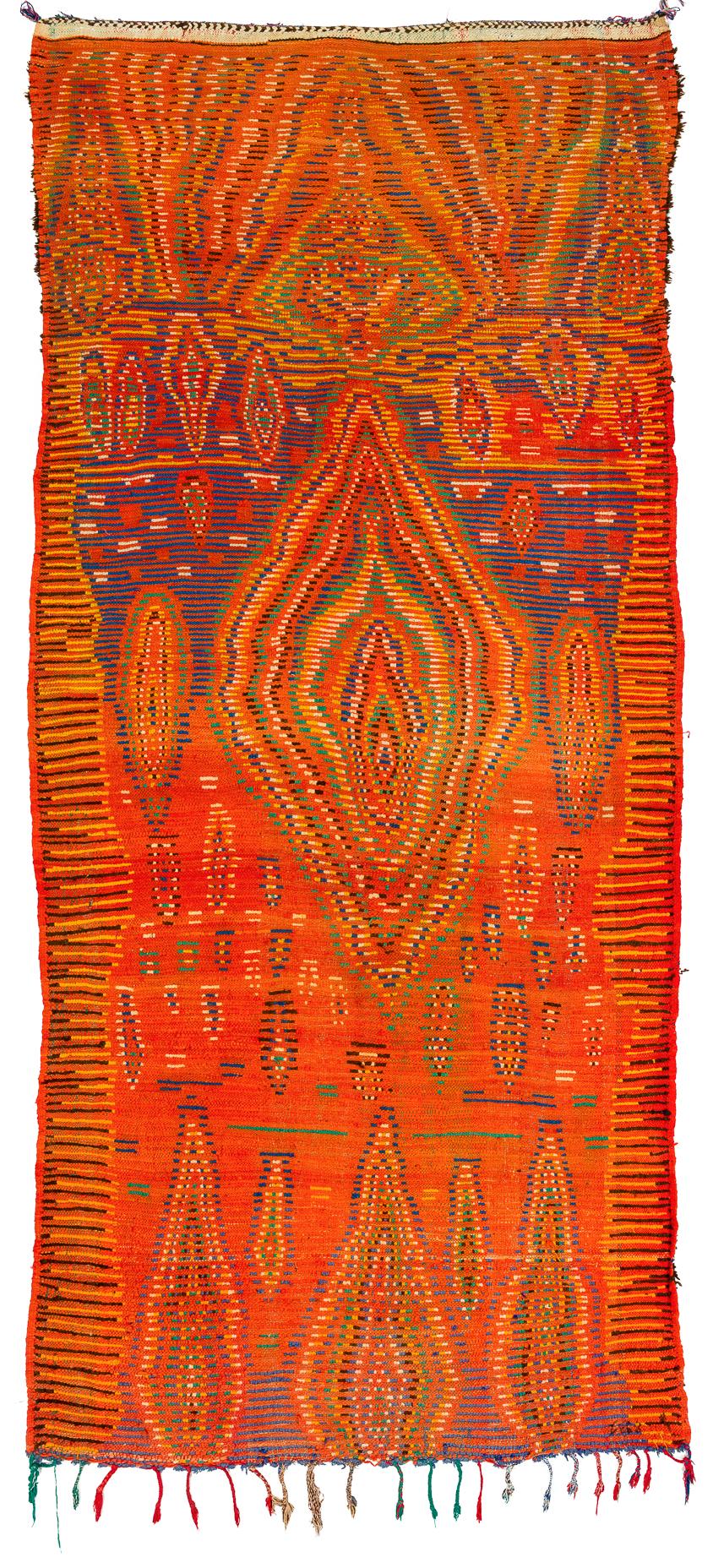 A dynamic and primitive rug from Morocco, probably woven the 1970s. We have not seen another one like it, a true example of art for the floor. Measures: 5'2” x 11' 7”.