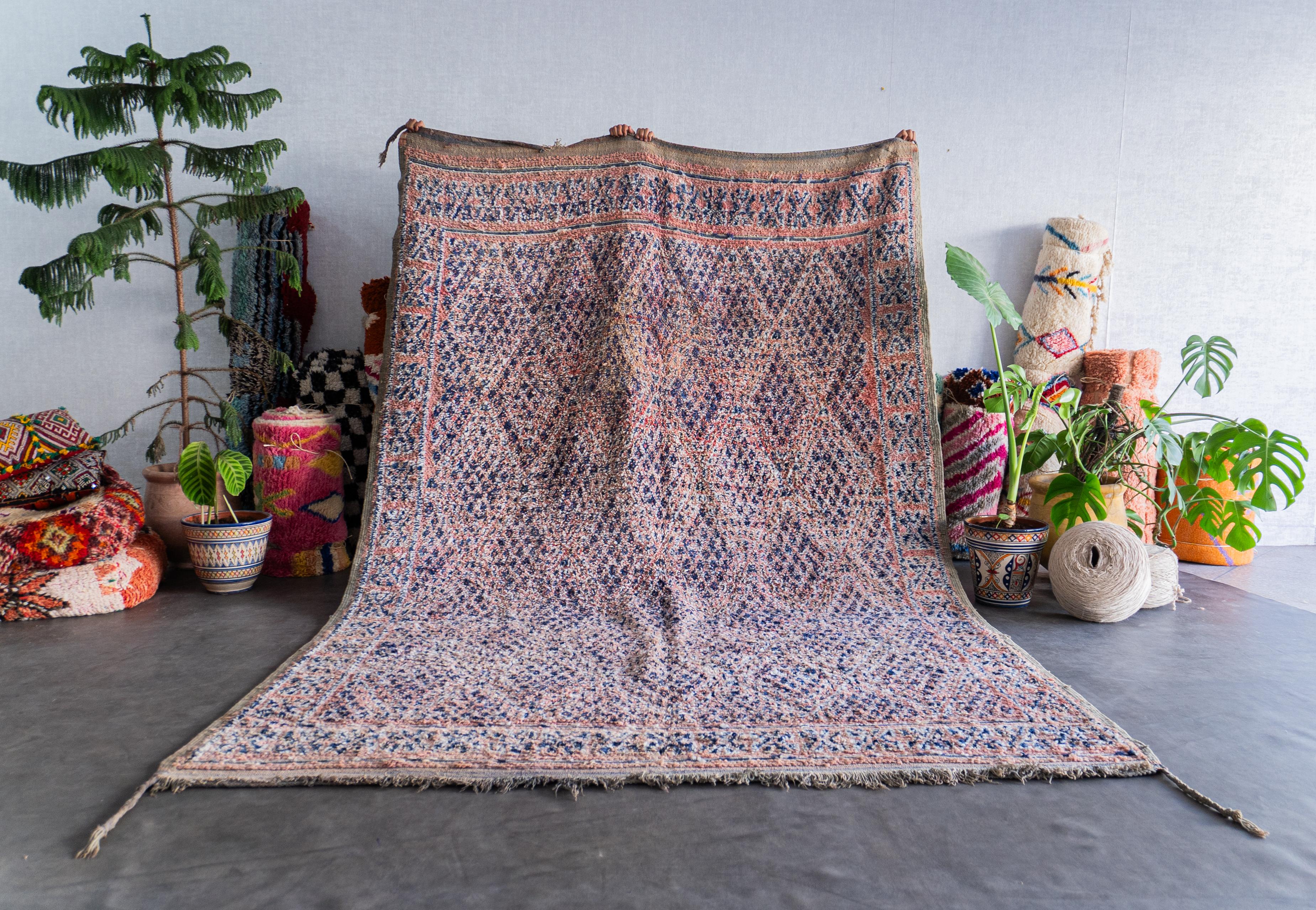 Uncover the rich heritage woven into our Moroccan vintage rug. Handmade by skilled artisans using time-tested techniques, each Berber rug is a unique narrative, echoing the cultural tapestry of Morocco. With intricate geometric patterns and a warm