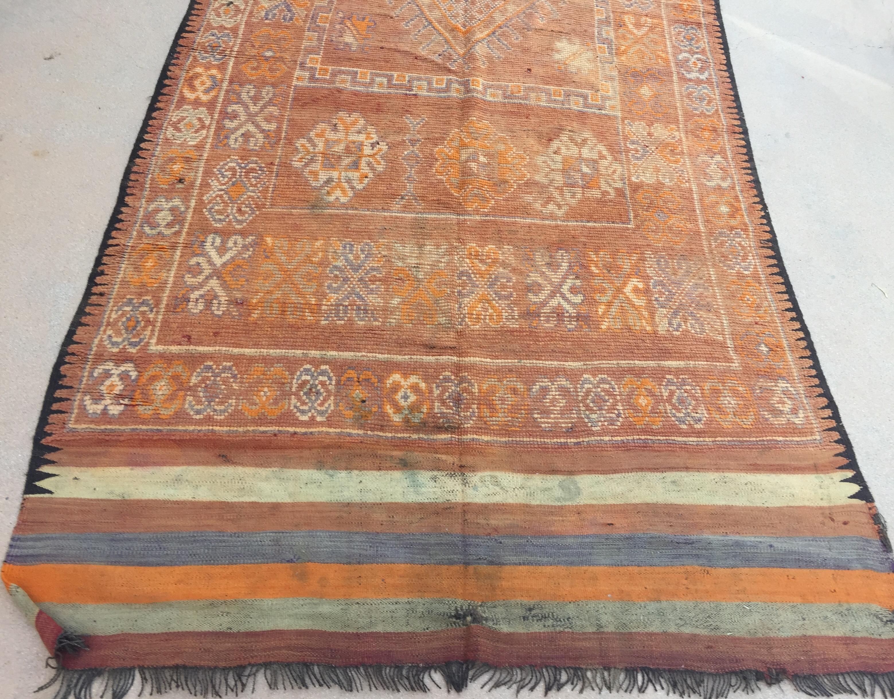 1960s Large handwoven vintage Moroccan Berber Tribal rug, nicely aged and faded with orange and blue cors.Midcentury Moroccan area rug with tribal geometric design on blue backgroundHandwoven by The Berber tribes in Morocco with traditional