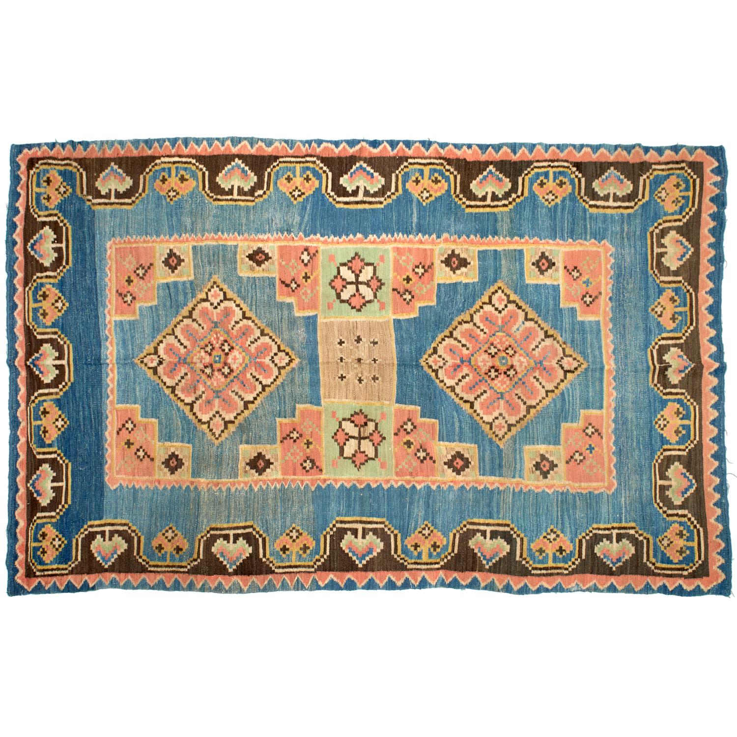 Antique early 20th century Moroccan Kilim rug, with two central diamond medallions, 
made in simple flat-woven or tapestry technique, in which the pattern is produced by horizontal wefts that cover the vertical warps. The ground is a denim blue