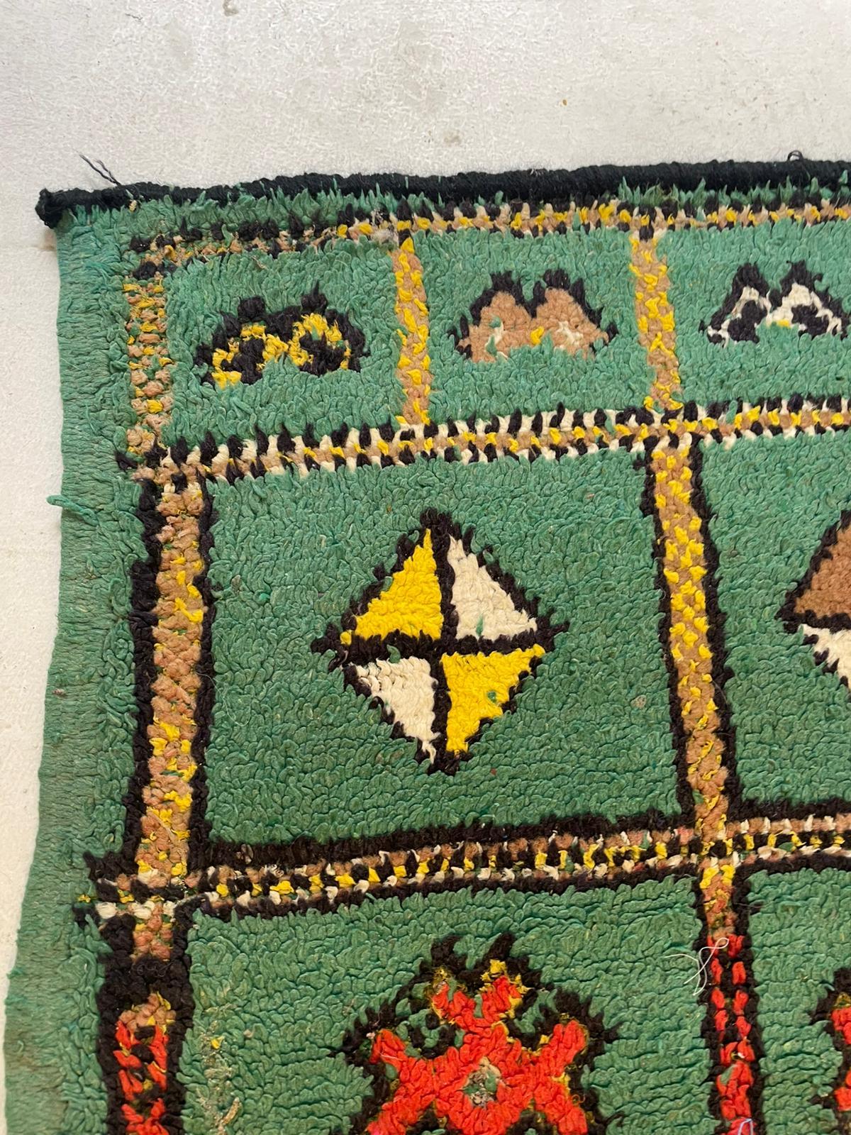 Description
A richly textured and vibrantly patterned vintage Moroccan Boucherouite rug, hand-knotted by Berber artisans of the Middle Atlas or Beni Mellal region, dating from the 1900's-1910's This unique piece features a lush shag pile
