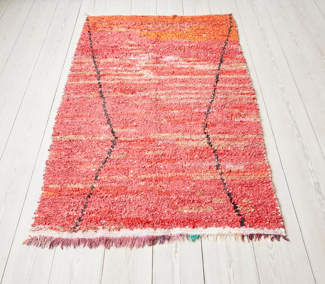 Lovely vintage Boucherouite rug in different tones of red (red, orange and pink).