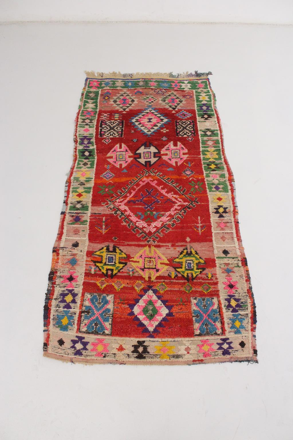 How lovely is this one!! Such a sweet and fun vintage rug with bright colors and traditional berber designs all over it! Main colors are a bright red and pink with pops of blue, purple, cream, black, yellow, green...

Its dimensions make it the