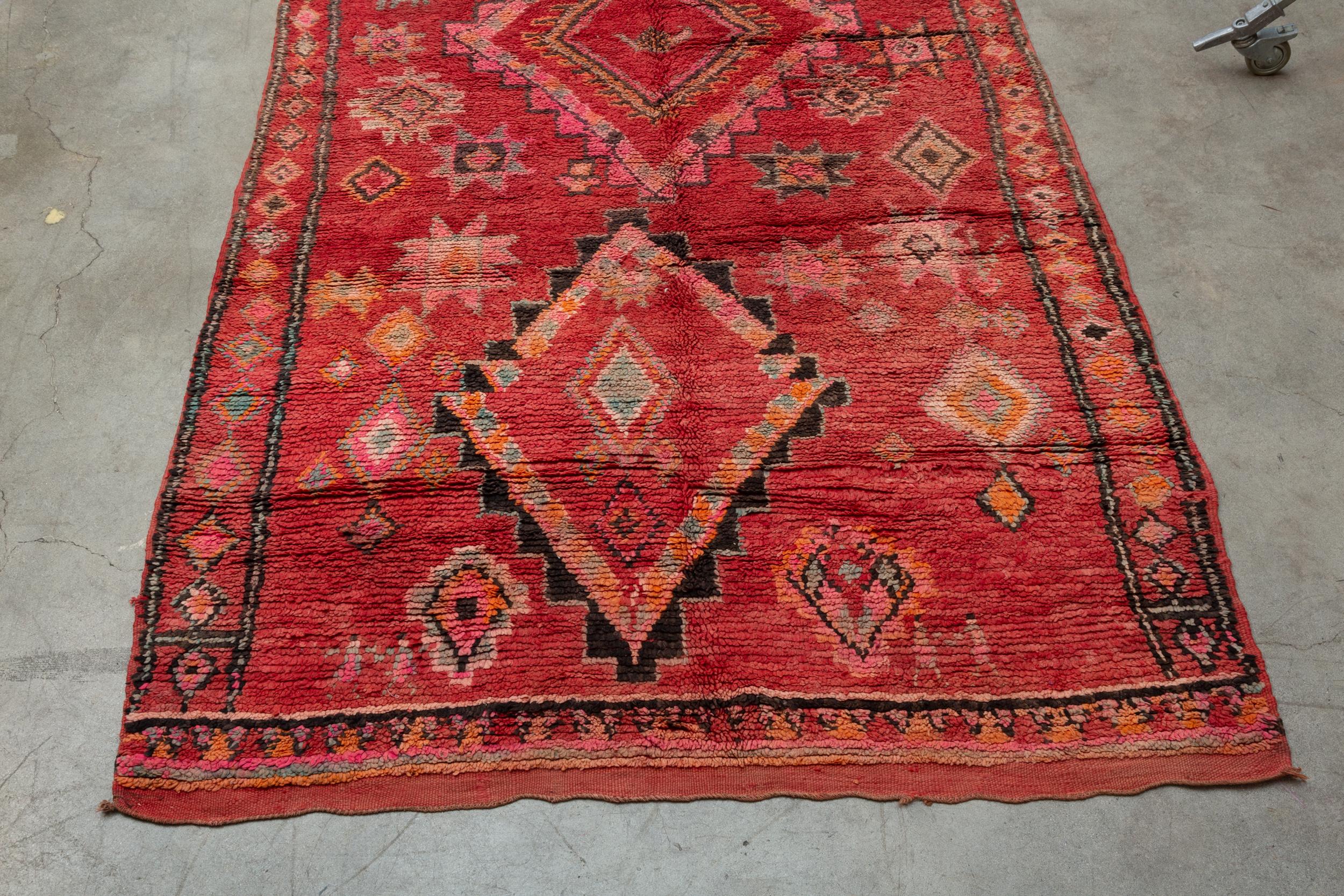 Boujad is a large widespread area and not a tribe. Since they are woven by a number of tribes so they can display varying techniques and styles. Originating in the Middle Atlas region of Morocco, Boujad rugs are low-pile soft wool and known for