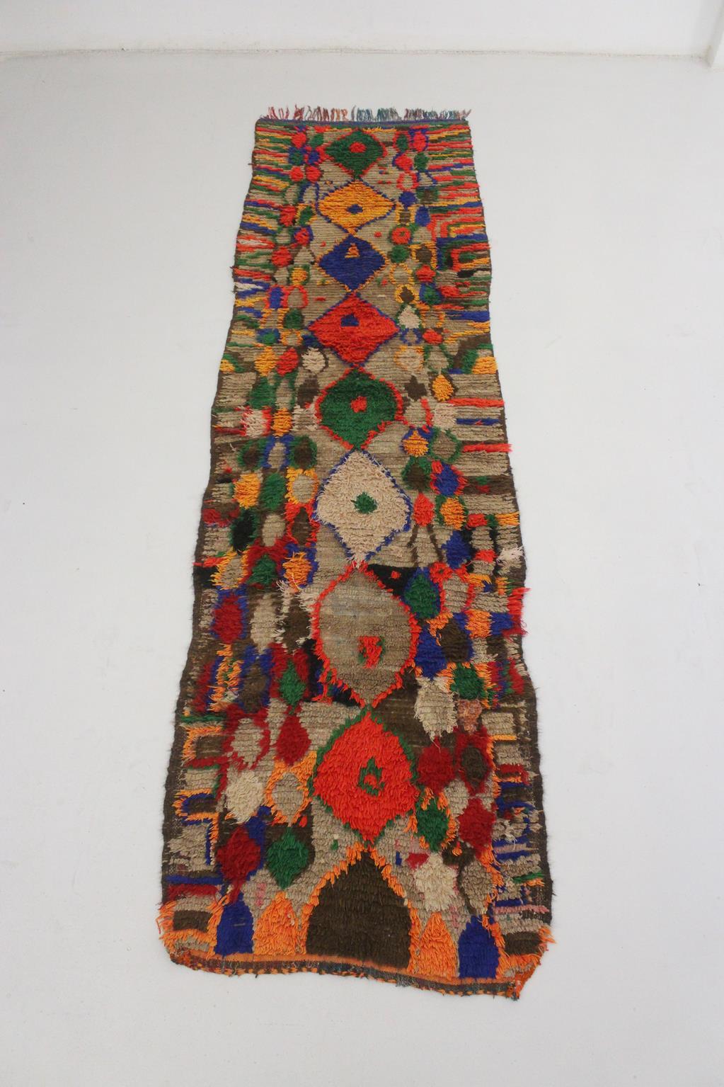 This long runner rug was hung on a wall at the vintage market in Marrakech the first time I saw it. I could appreciate its beauty at the first sight and it was an immediate yes for me!

Probably made in the area of Boujad, Middle Atlas, Morocco, the