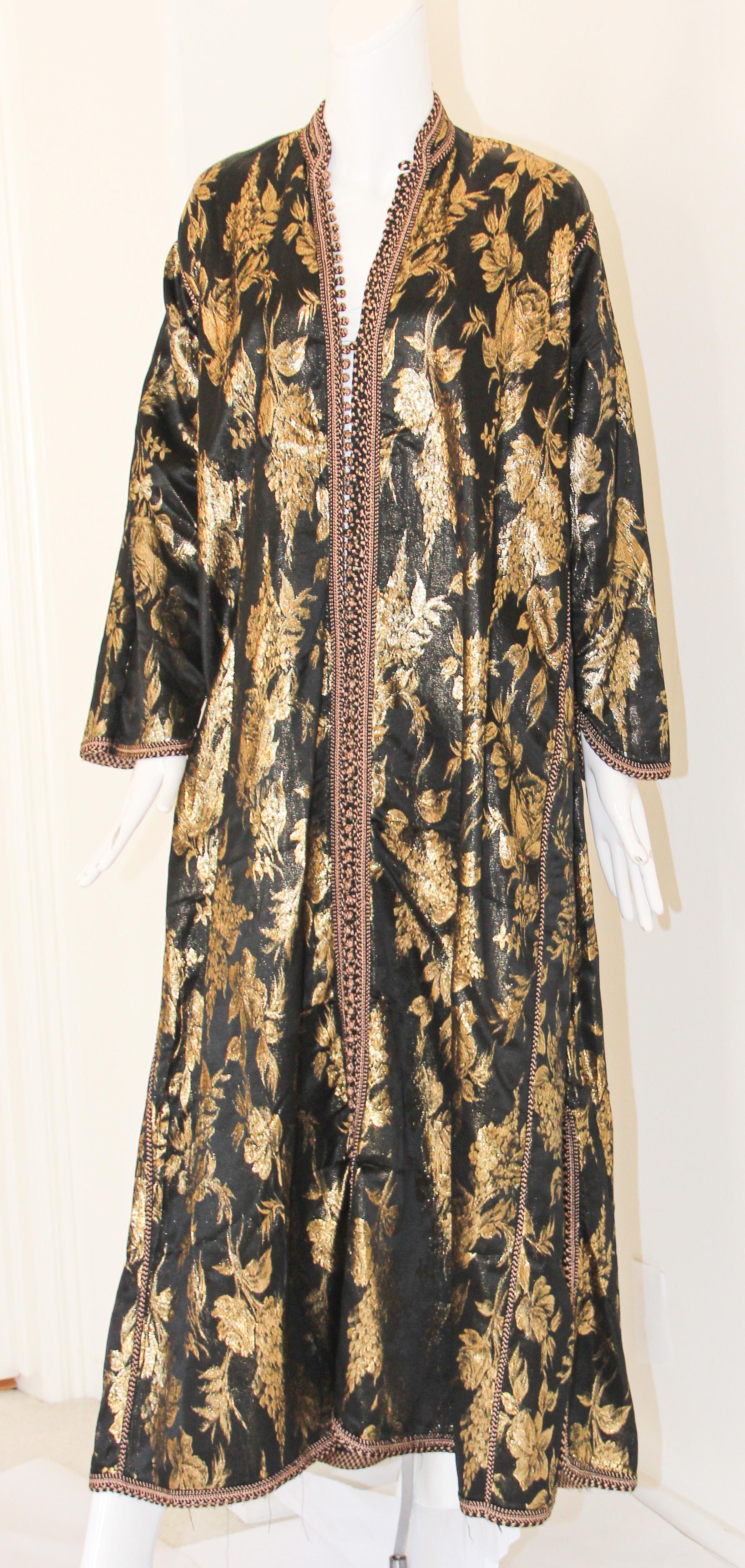 Amazing vintage Moroccan Caftan, black silk damask heavily with gold threads. Circa 1960's
The black heavy damask kaftan was entirely made by hand, fully lined.
One of a kind evening antique Moorish gown.
This authentic caftan has been hand-sewn