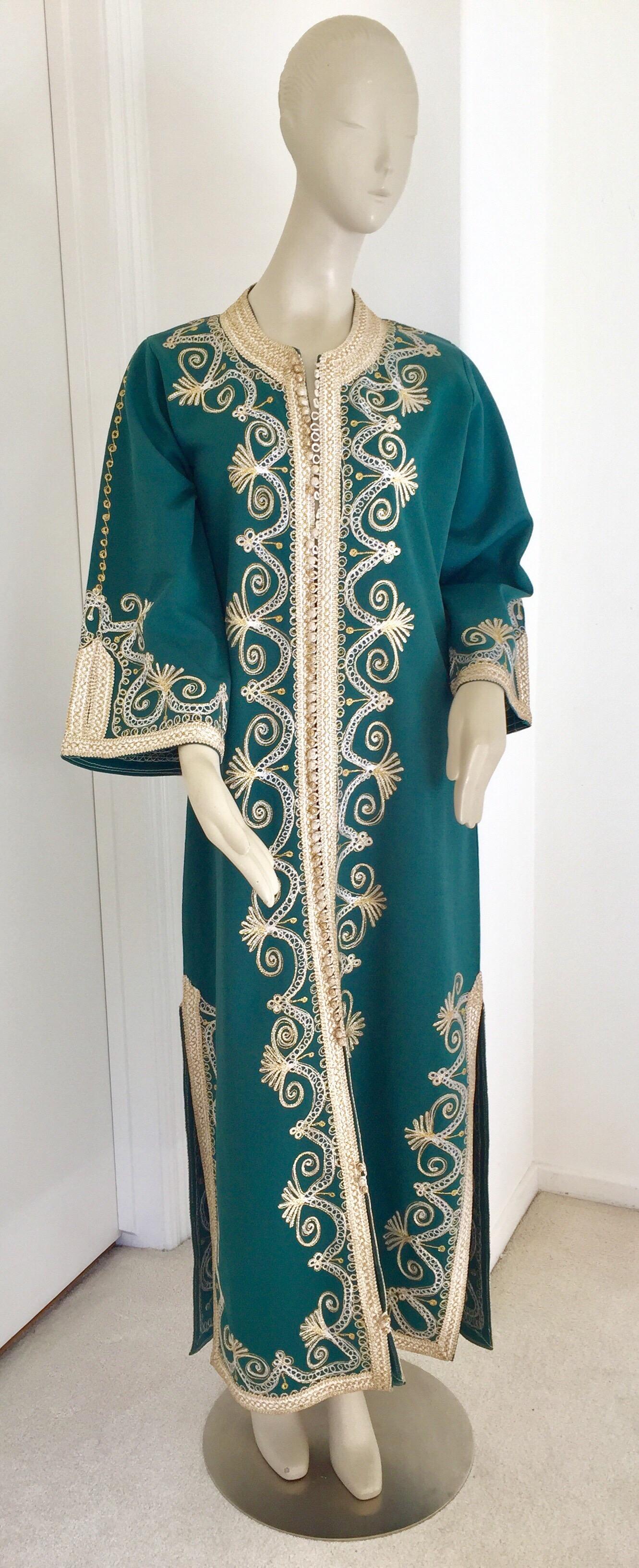 Elegant vintage Moroccan green caftan, poly jersey embroidered with black and gold threads design all-over. 
You could wear this maxi dress kaftan closed or open. 
The kaftan features a traditional neckline, with side slits and gently fluted