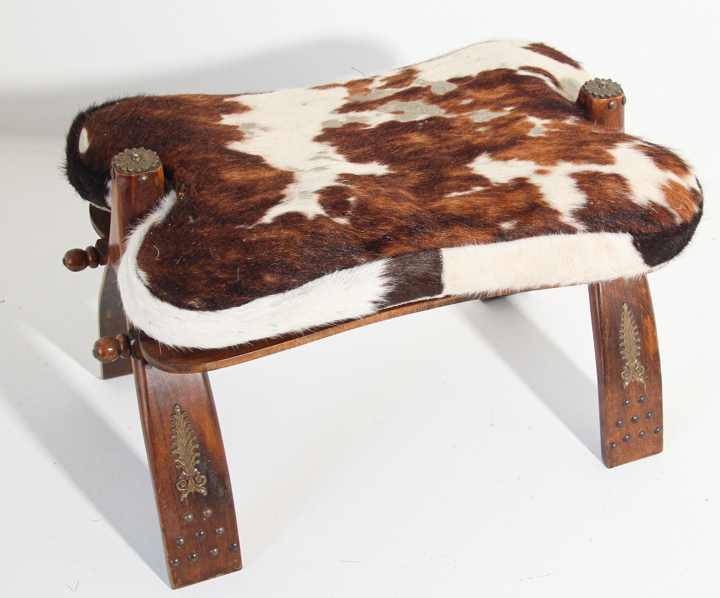 Vintage Moroccan, North Africa camel saddle shape stool.
Traditionally used to ride camels in the desert of Africa and the Middle East, this camel saddle could be used as a foot stool or just as an accent tribal piece in any room.
Wooden base is