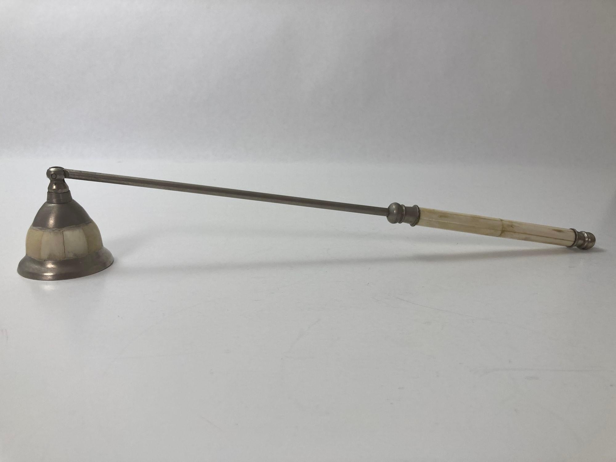 Moroccan Polished metal articulated candle snuffer with bone overlaid handle and snuffer.
Vintage Moroccan bone and metal candle snuffer.
It is in wonderful vintage condition with nice patina.
It is about 14