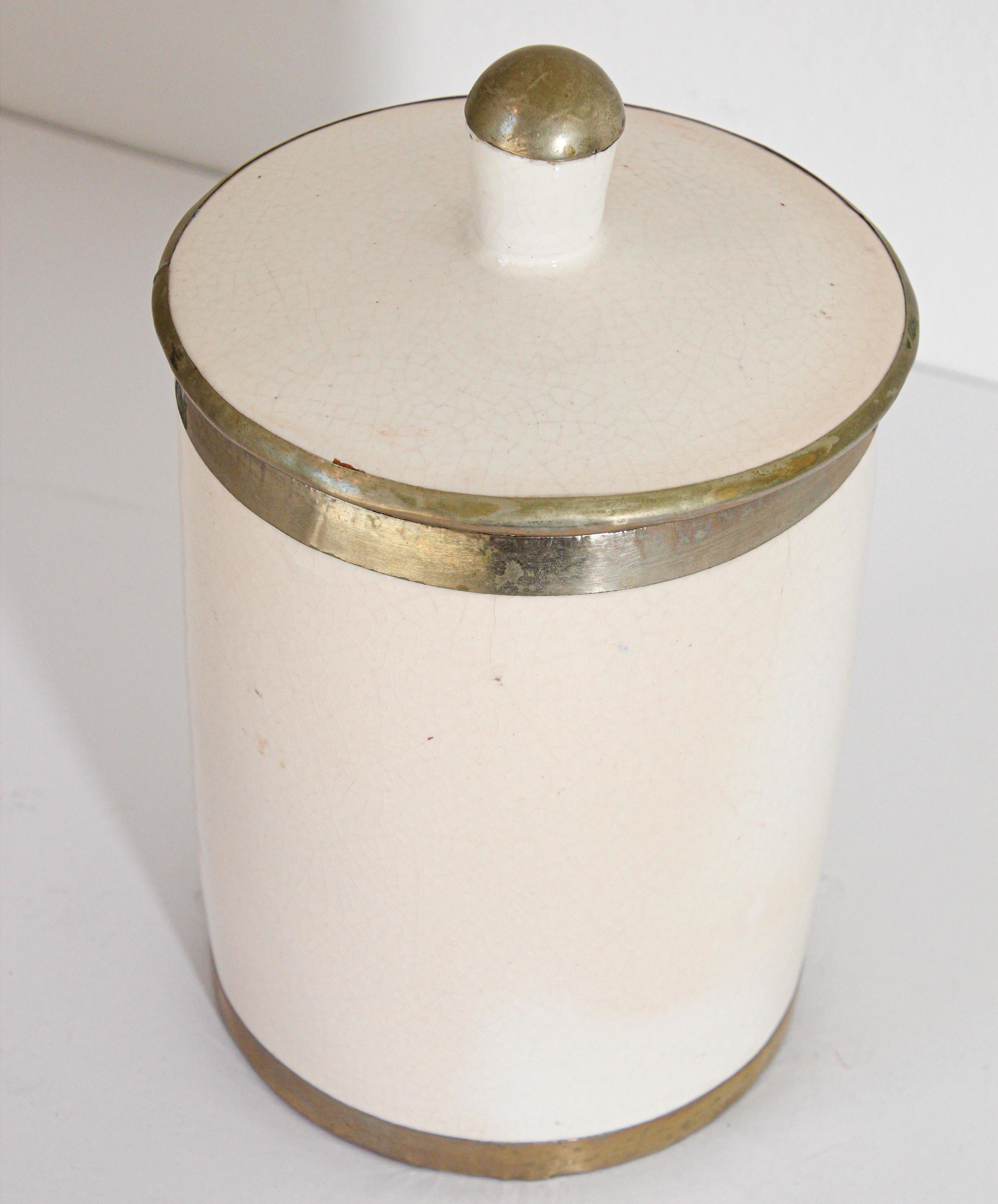Vintage Moroccan Ceramic Urn with Lid, white crackled ceramic with silver overlaid.
Great to use in the kitchen or in the bathroom.
Great folk art vintage Moroccan decorative small ceramic urn with lid.
Handcrafted in Safi Morocco, Circa