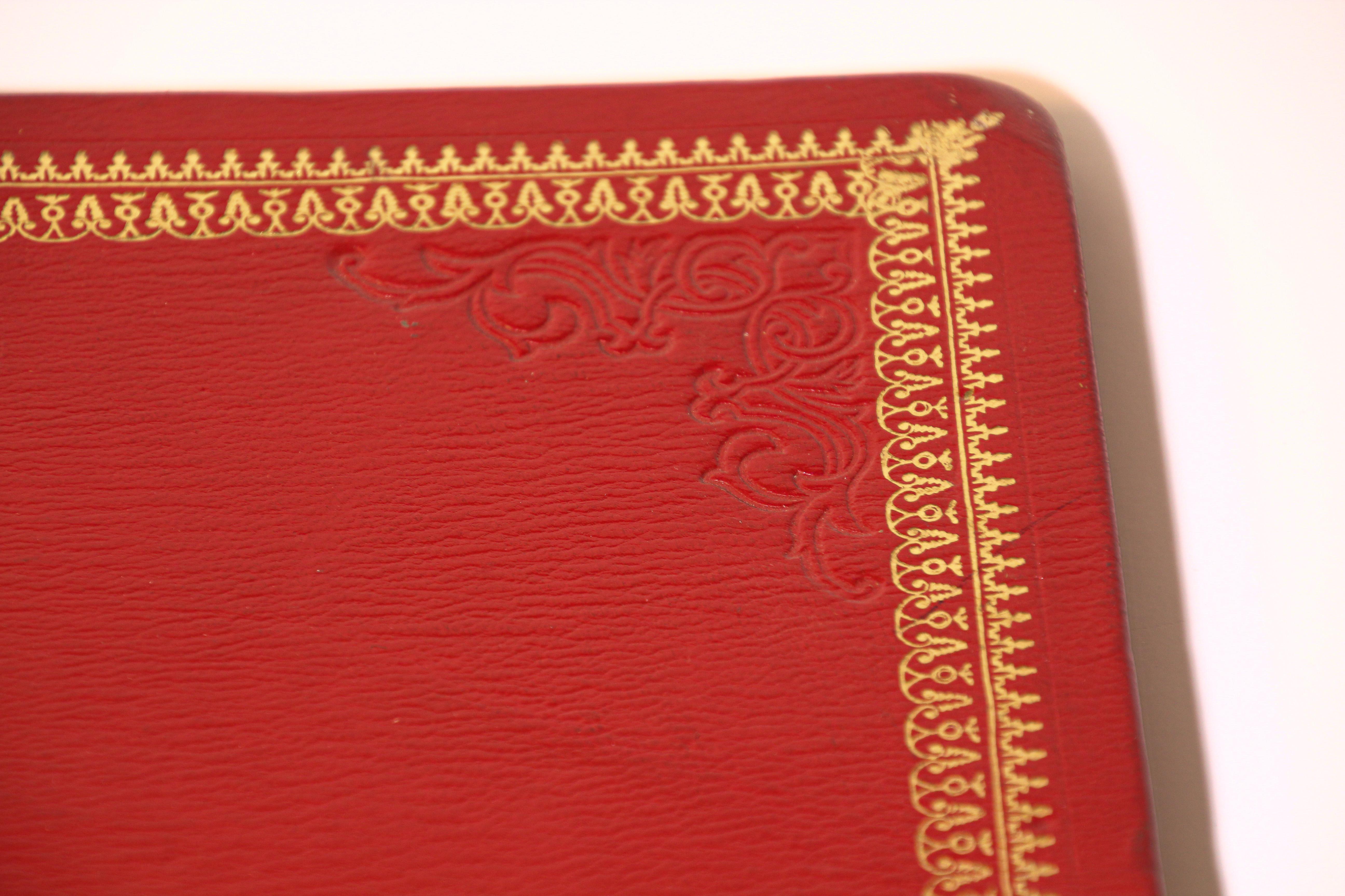 Vintage leather Moroccan embossed leather padfolio.
Red vintage leather portfolio embossed with gold 22 carat design.
Handmade leather stamped with 22 karat gold designs. 
Size is 14