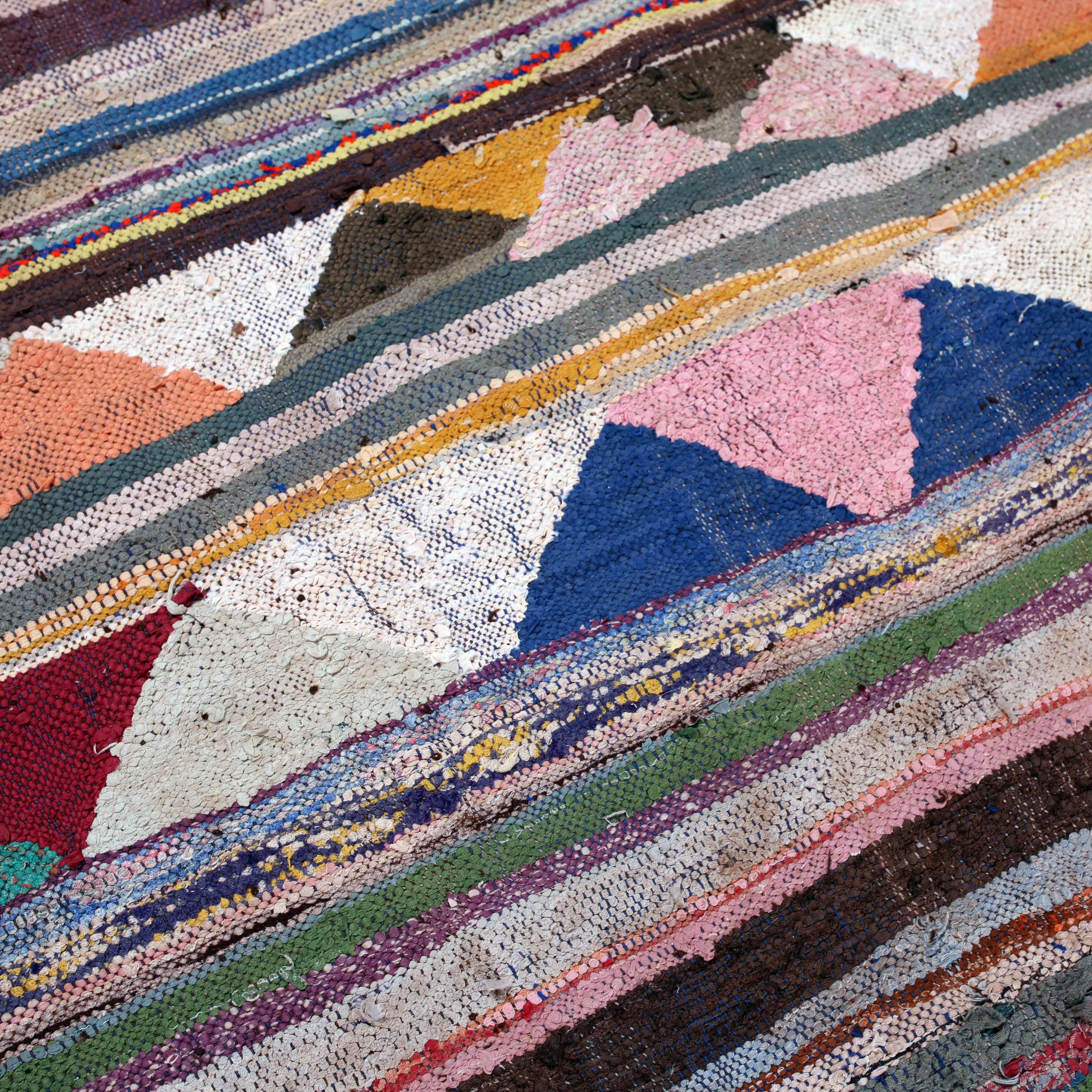 This emblazoned handwoven rug from Morocco brings every room to life. The materials used include recycled rag strips and yarns from a variety of found textile remnants including wool, cotton, synthetic fibers.

From the late 1980s, the making of