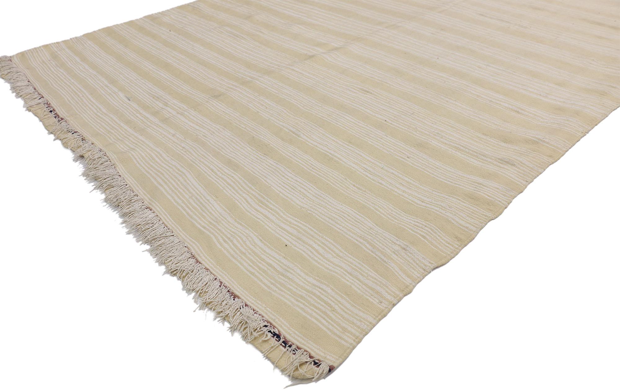 20815, Vintage Moroccan Handira Kilim, Neutral Flat-weave Rug. This neutral flat-weave Kilim rug emanates function and versatility with relaxed hygge vibes. This handwoven wool vintage Moroccan Kilim rug features rows of creamy-vanilla bands and