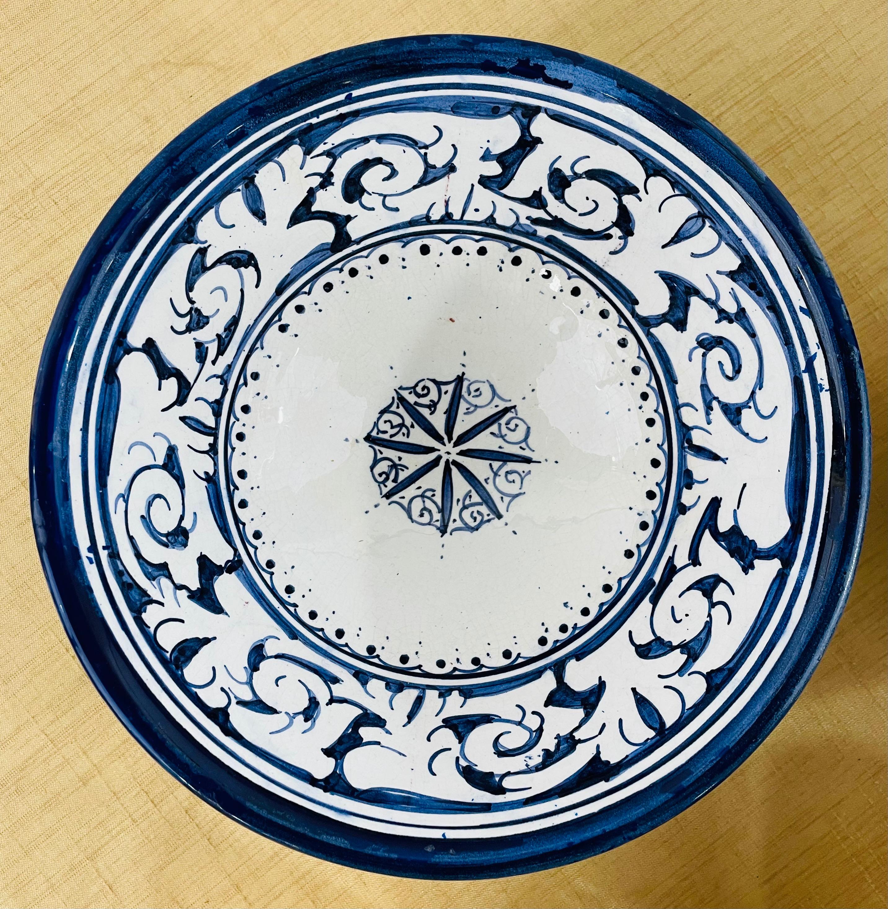 A set of four handmade vintage Moroccan bowls. With a wonderfully intricate and harmonious arabesque design pattern, this handcrafted set of blue and white ceramic bowls will add an exotic touch of color and distinction to your dining experience.