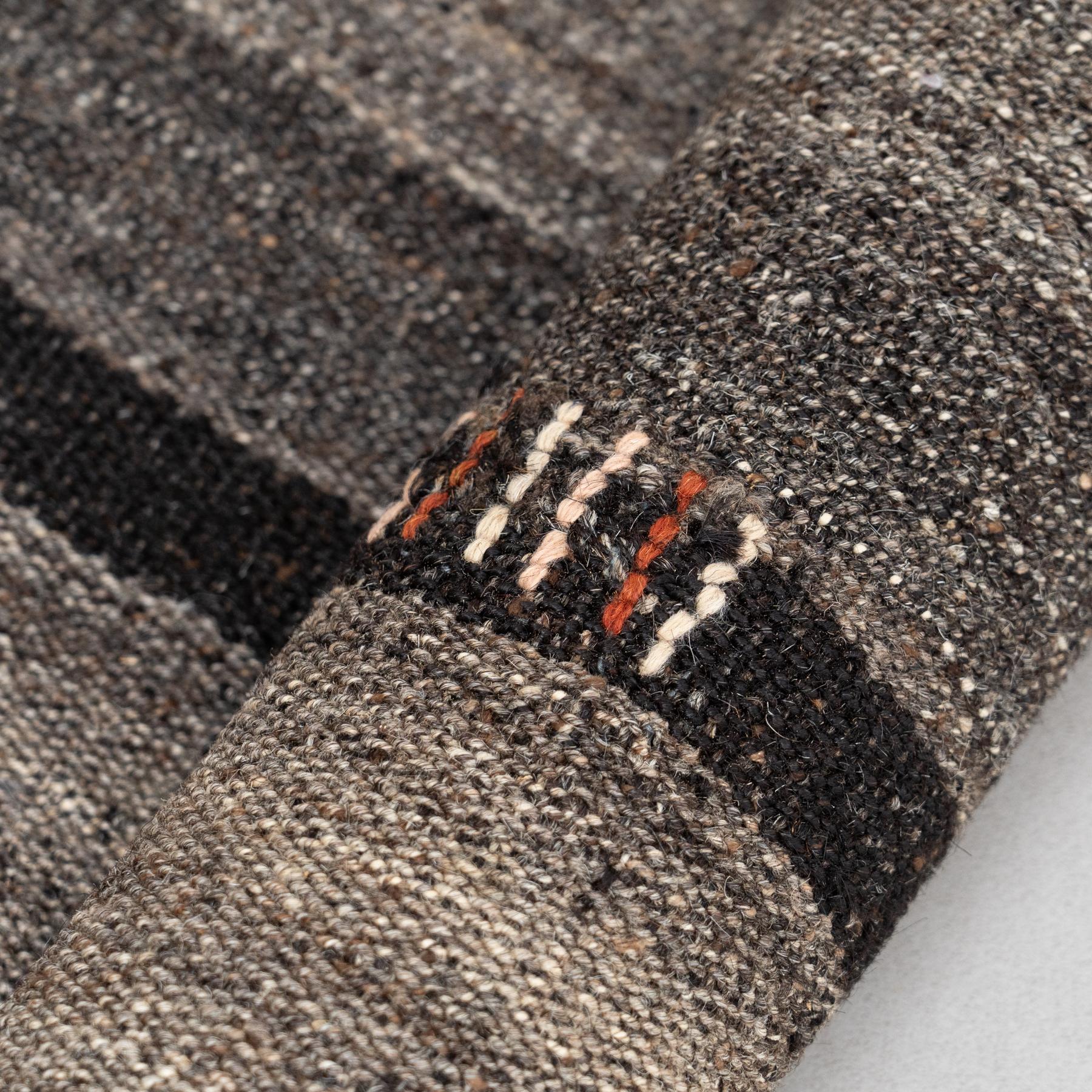 This stunning vintage Moroccan rug, crafted by hand around the 1980s, showcases beautiful grey tones in high-quality wool, making it an elegant yet versatile piece. Measuring 173 x 195 cm, it’s perfectly sized to enhance any room—whether used as a