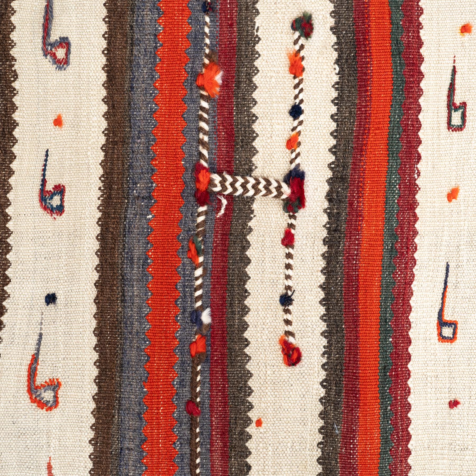 This exquisite vintage Moroccan rug, handmade around the 1980s, is crafted from high-quality wool in a striking combination of warm orange and natural beige tones. Measuring 129 x 157 cm, it’s a versatile and visually captivating piece, perfect for