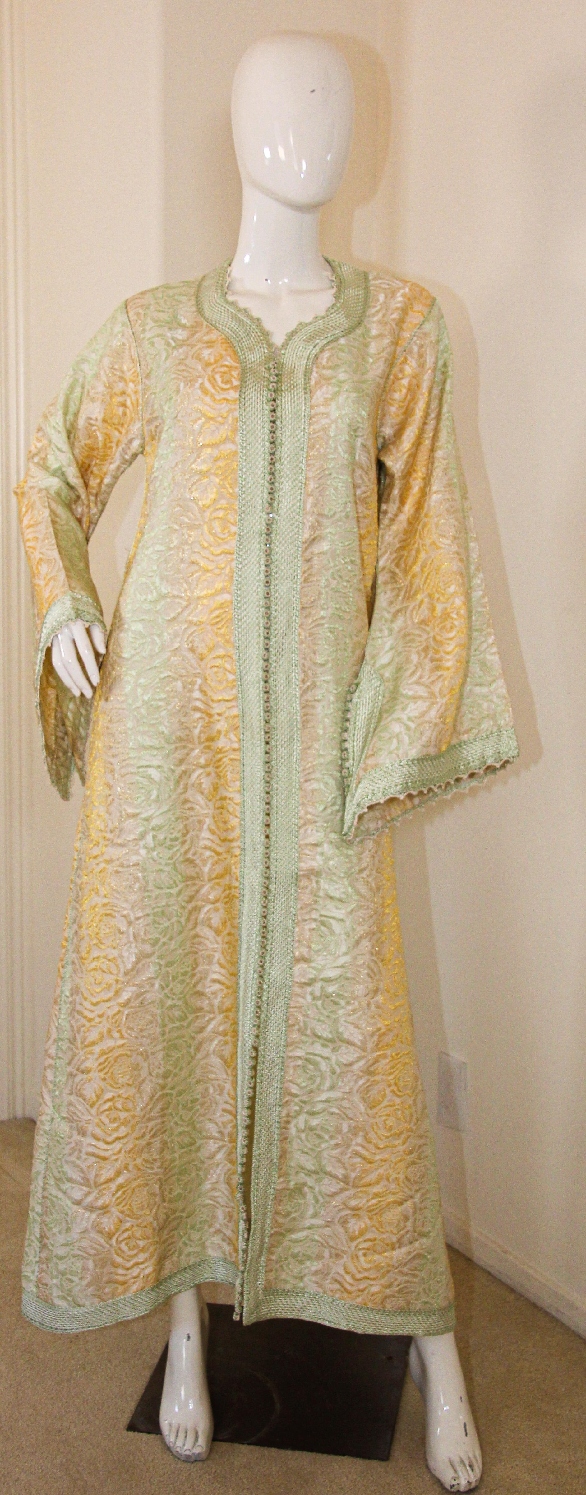 Amazing vintage Moroccan Caftan, gold damask with gold and sage rim threads, Circa 1970's
One of a kind evening antique Moorish gown.
This authentic caftan has been hand-sewn from damask fabric intricately embroidered with silk threads rim.
The