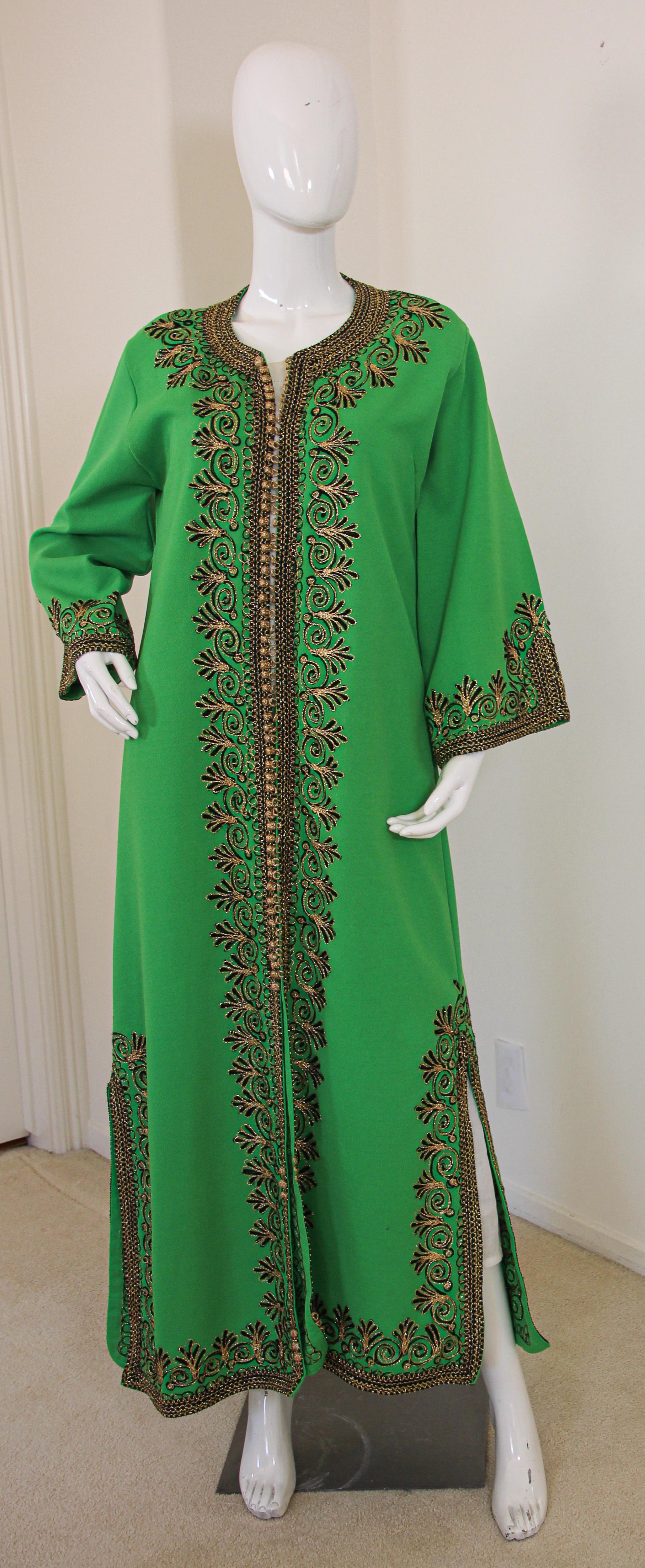 Elegant vintage Moroccan green caftan, poly jersey embroidered with black and gold threads design all-over. 
You could wear this maxi dress kaftan closed or open like a coat. 
The kaftan features a traditional neckline, with side slits and gently