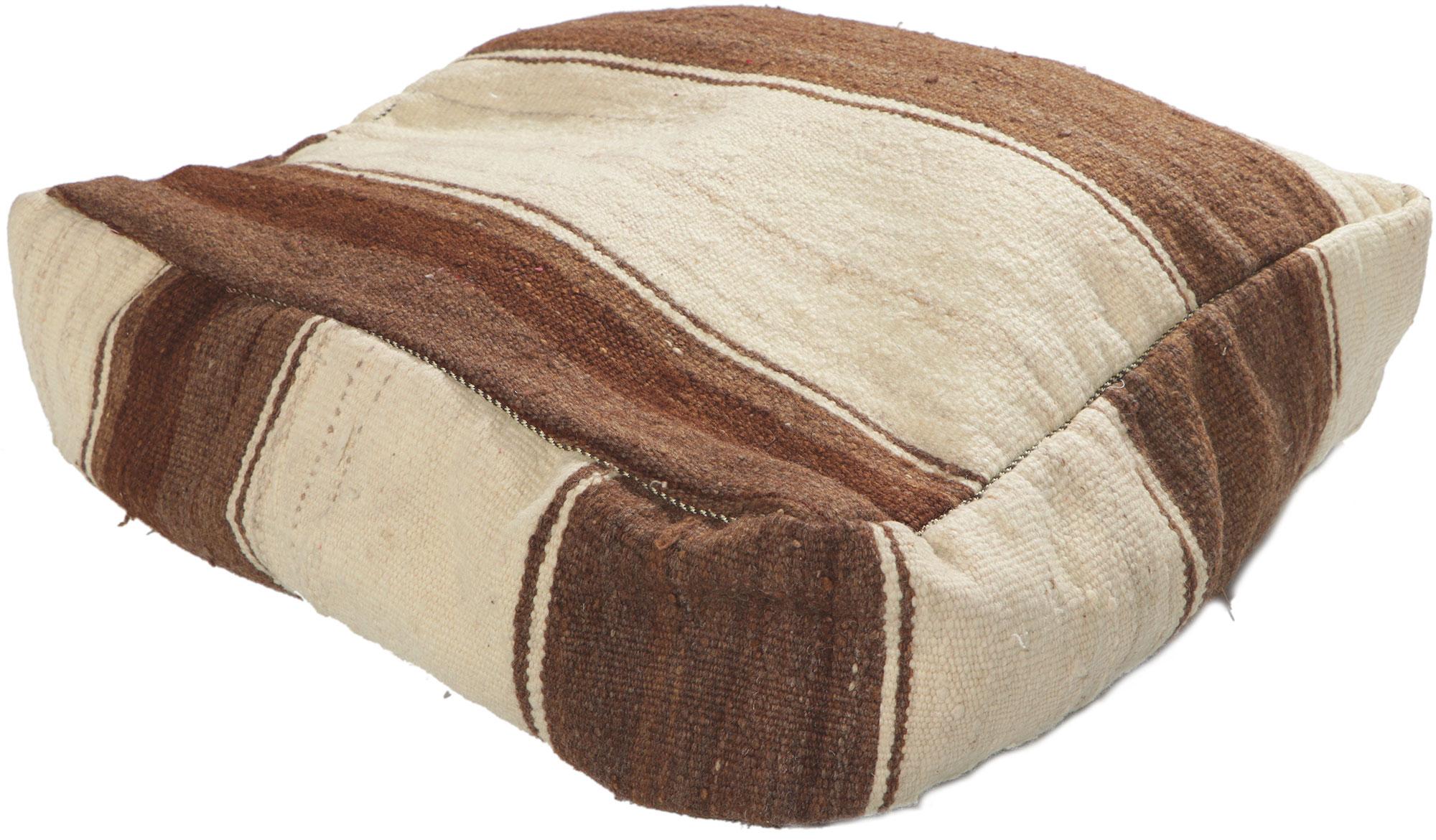 78411 Moroccan Vintage Kilim Pouf Ottoman, 2 x 2 x 1.
Emanating nomadic charm with elements of comfort and functional versatility, this vintage Moroccan pouf conjures the spirit of Morocco. Made by talented artisans from the Atas Mountains of