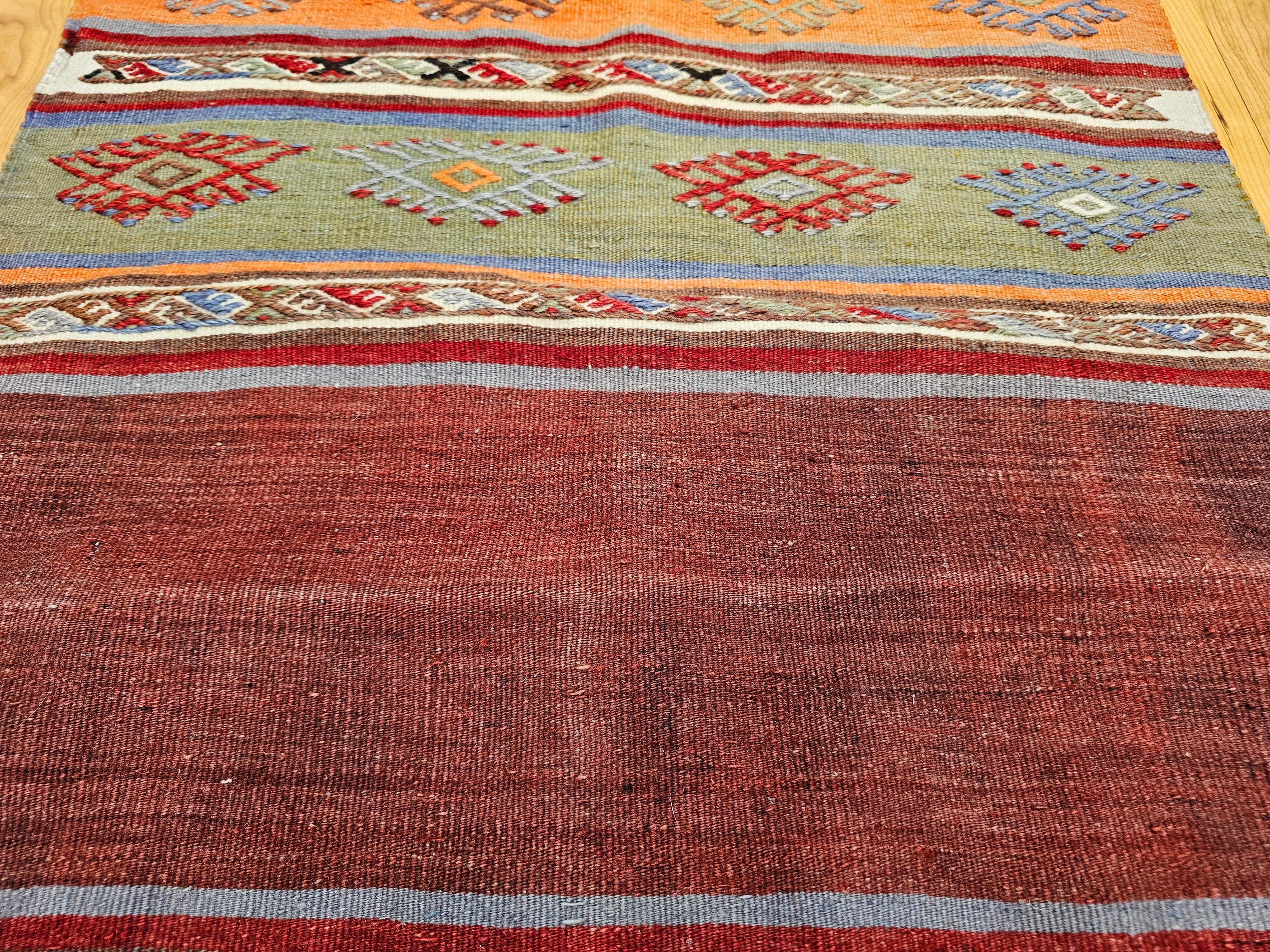 Wool Vintage Moroccan Kilim Runner in Geometric Banded Pattern in Red, Purple, Green For Sale