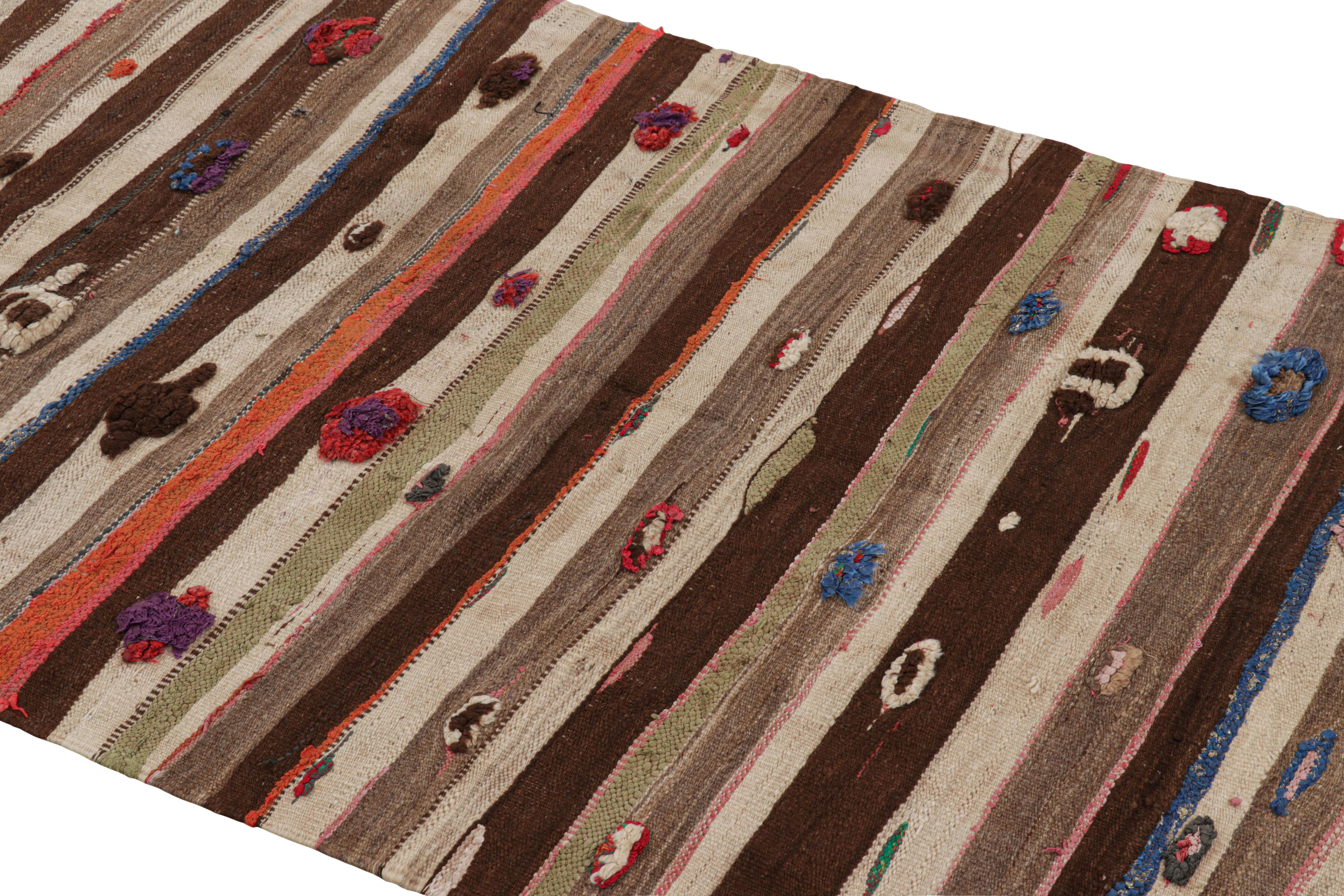 Handwoven in wool and originating from Morocco circa 1950-1960, this 4x7 vintage Moroccan Kilim and runner rug is a gorgeous example of its provenance—an exciting new curation from Rug & Kilim. 

On the Design: 

Admirers of the craft will note what
