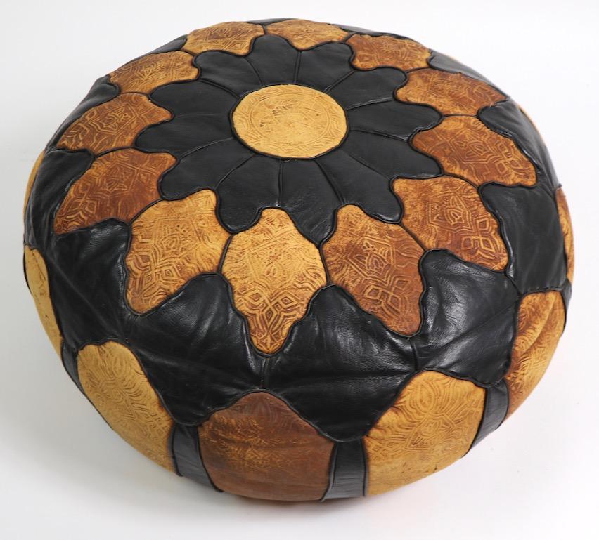 Nice vintage Moroccan pouf of pieced leathern and suede, with tooled decoration. Good original condition one very slight opening in one seam, pictured. Clean and ready to use.