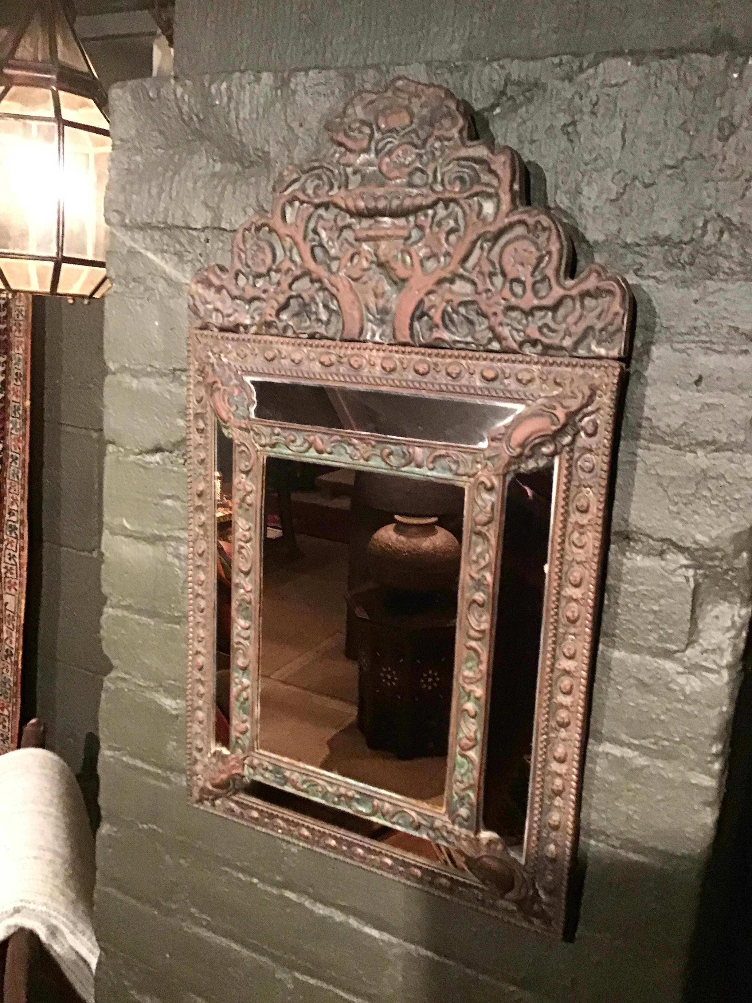 Beautiful vintage Moroccan wall mirror featuring intricate design all around. This mirror has so much character and will definitely be the statement piece in any space.