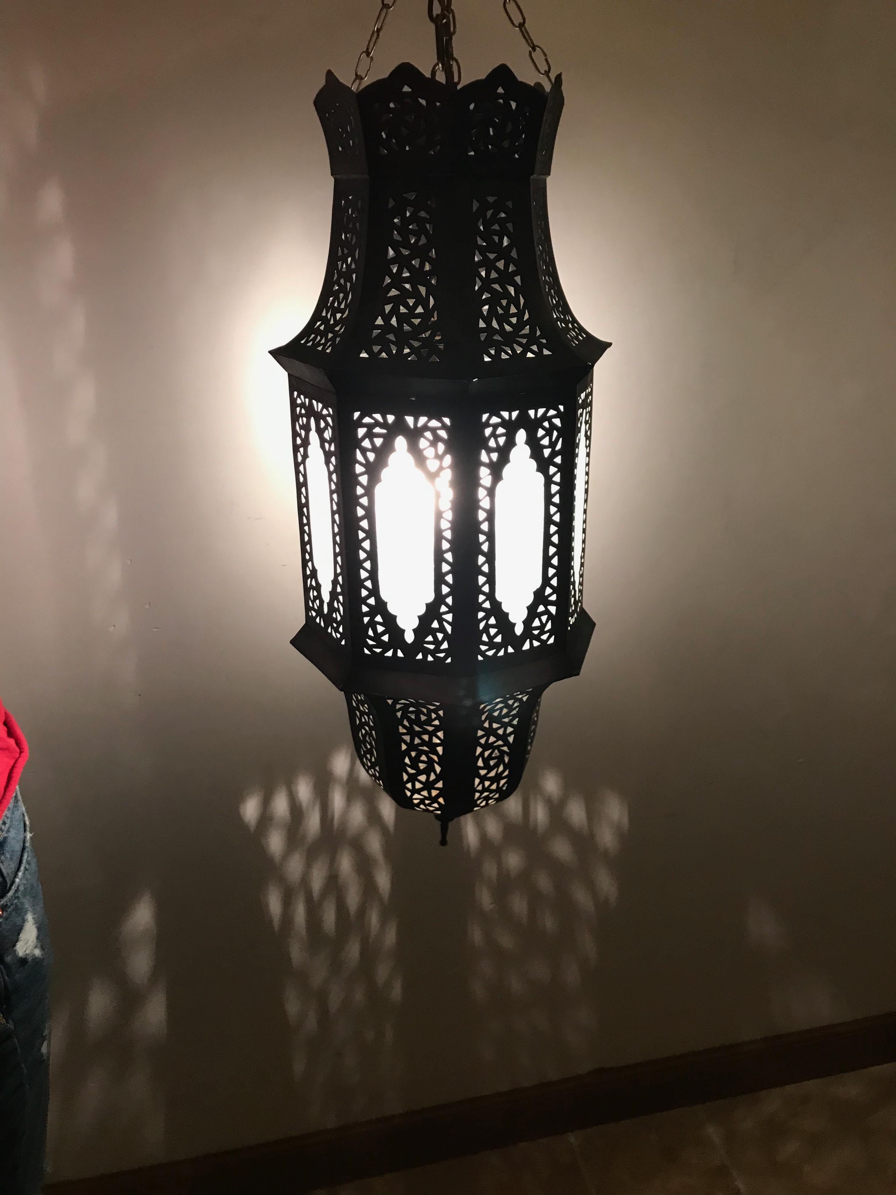 Moroccan handmade cut filigree brass lantern with frosted glass panels, circa 1940. Lovely warm patina gained from years of use.
Rewired and ready to hang .
The lantern measures 62 cm H (24