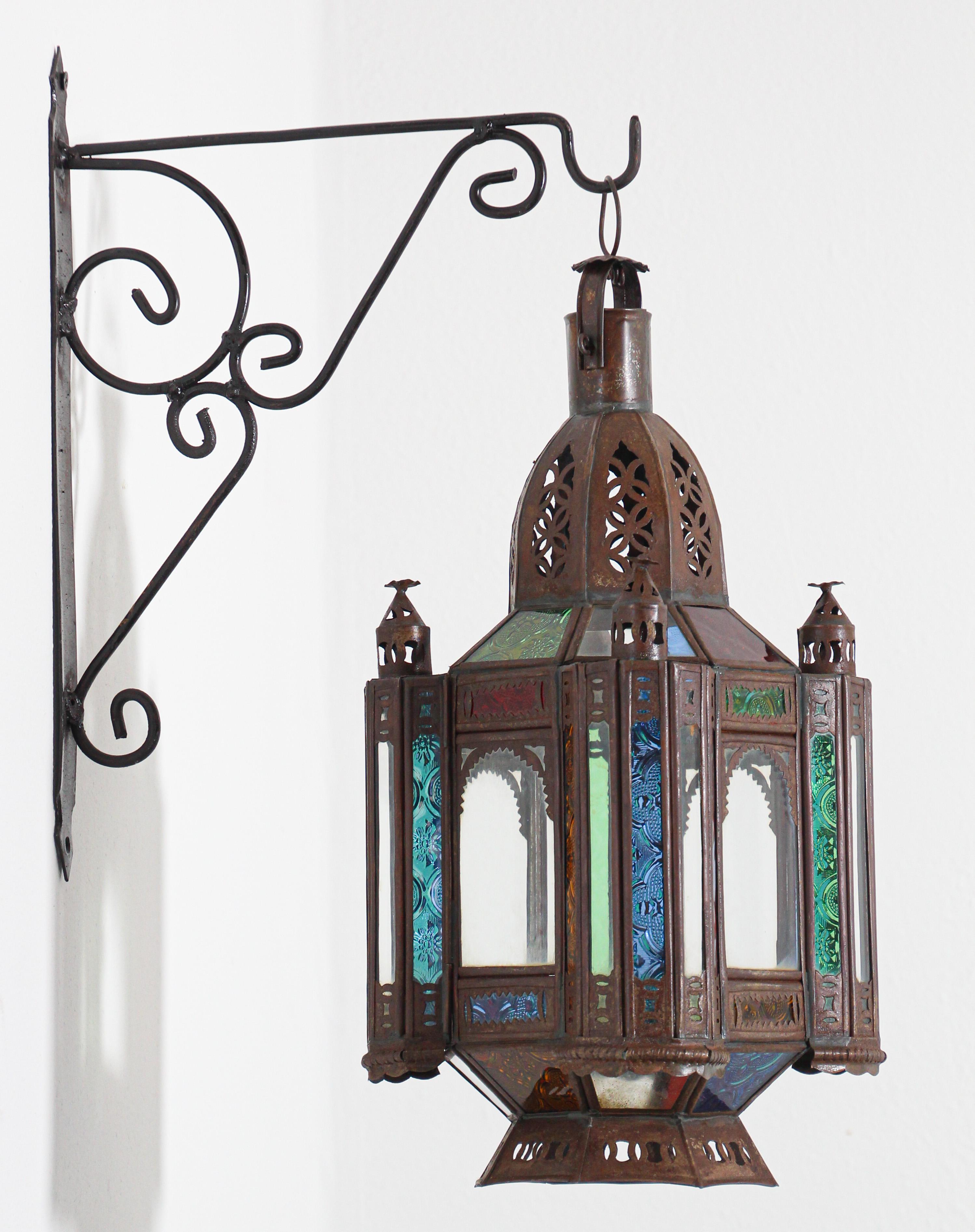 Vintage Moroccan Moorish metal and stained colored glass candle lantern
Handcrafted small Moroccan glass lantern or Moorish pendant.
Multi-color molded glass in green, lavender, blue and clear.
Hurricane candle lamp handmade in Marrakech, vintage
