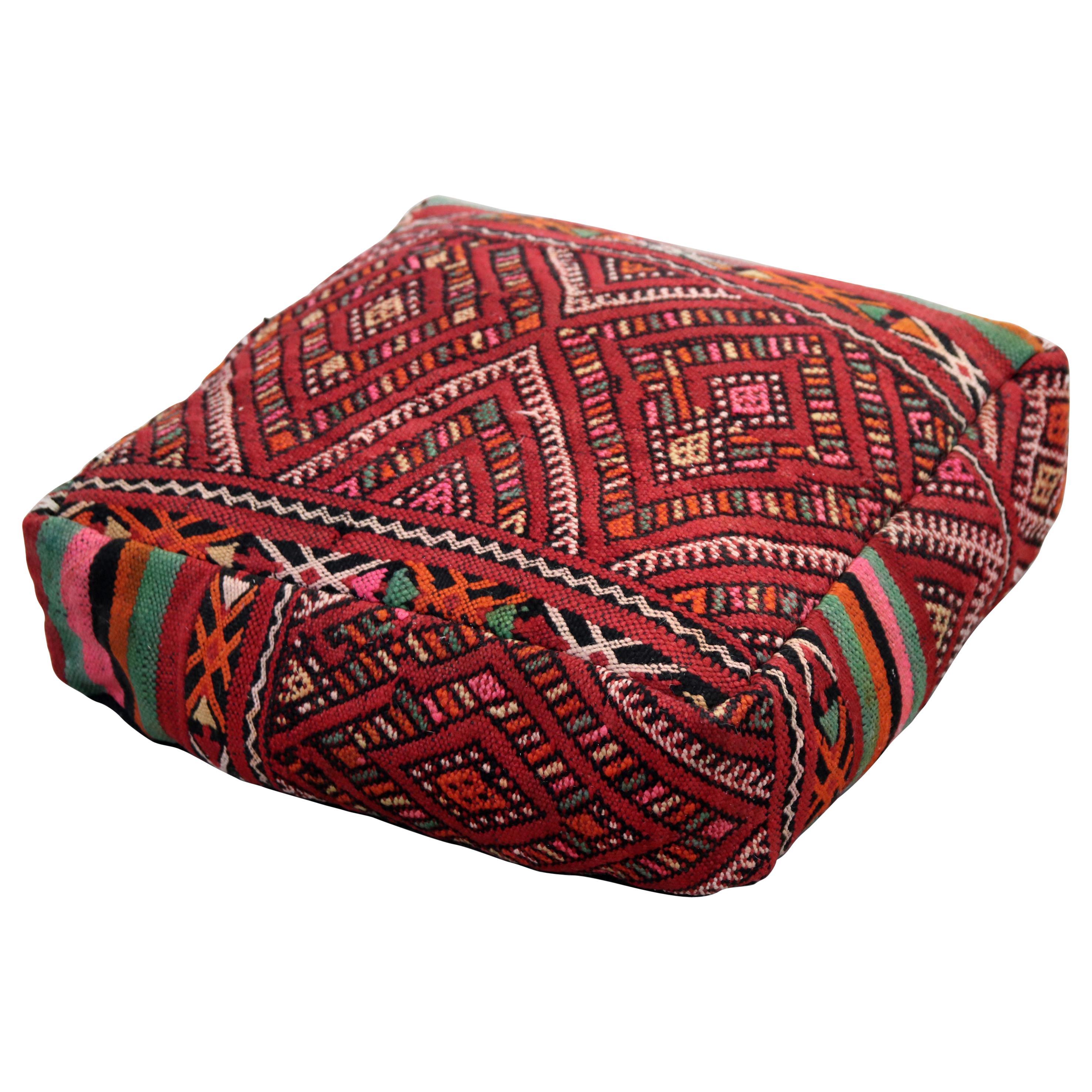 Vintage Moroccan pouf made from a Zemmour rug by Berber Tribe