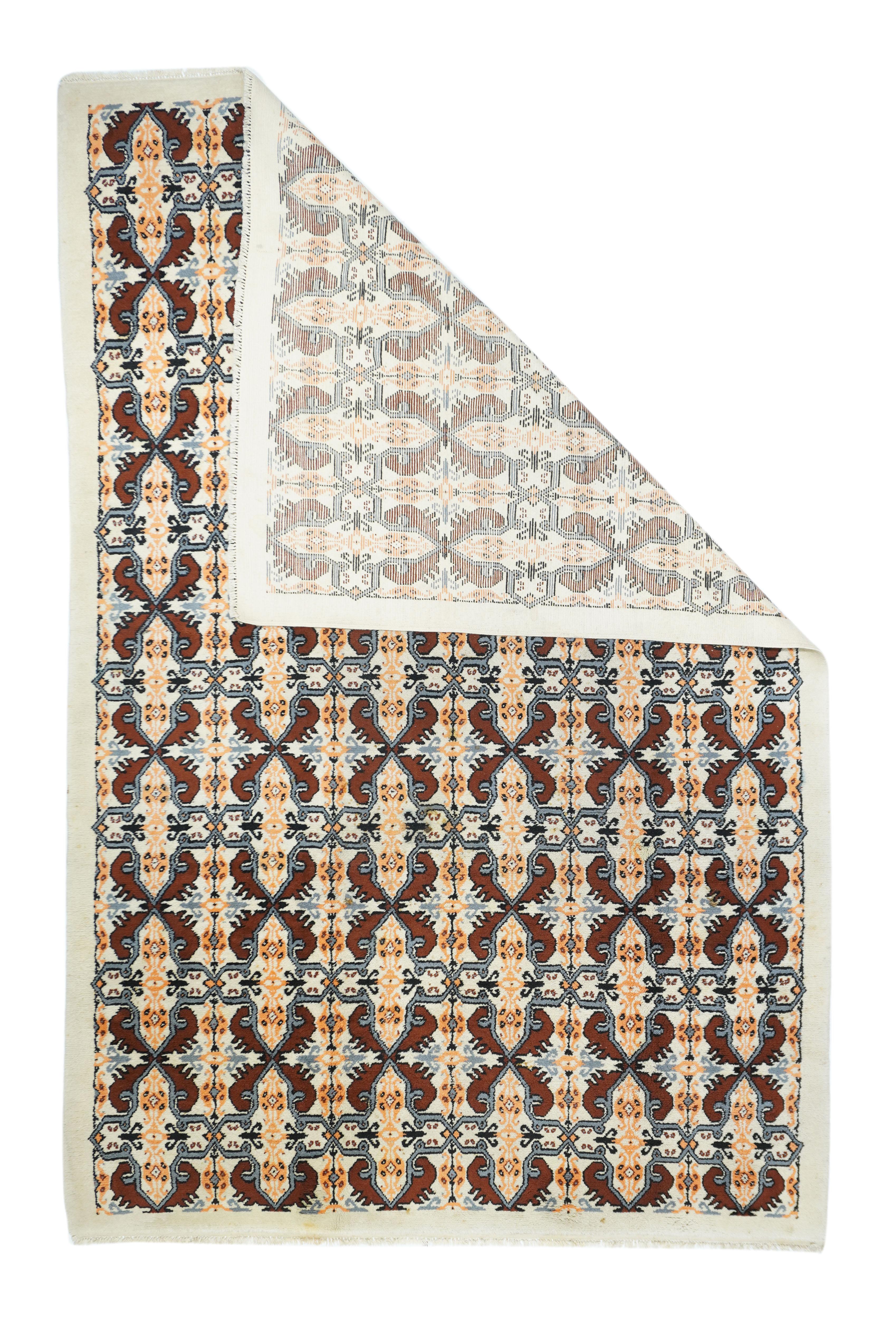 Vintage Moroccan rug 6'4'' x 10'. The sand ground shows an allover interlocking tile pattern of rounded octogrames and crosses. Red, green and khaki accents. Self-colored plain border. For a version, also with six column pattern and a rust-red