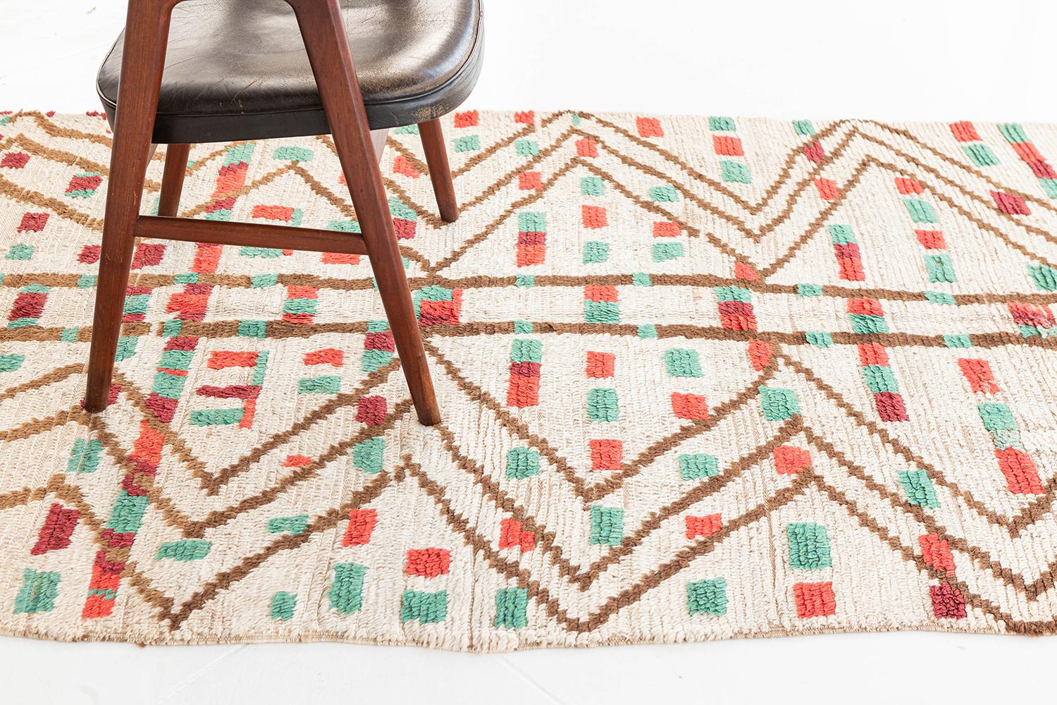 This chic and stylish Moroccan rug, an Azilal Tribe Design, from our Atlas Collection, feels like an ambience of summer season. A quirky design that easy to fall in love with. Colors of teal, valiant poppy, coral orange, and martini olives on the