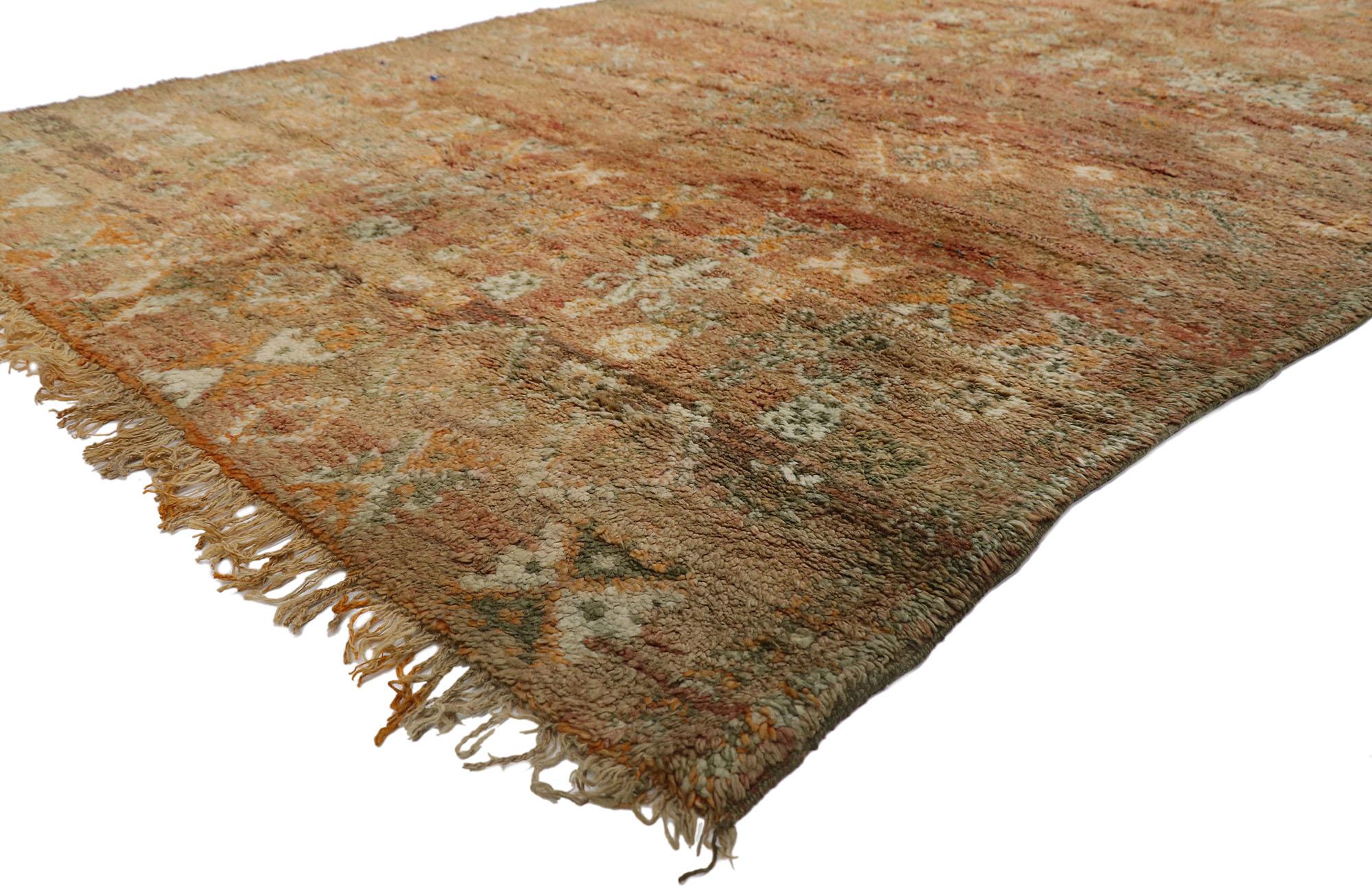 21253 Vintage Berber Moroccan Rug, 06'08 x 09'11.
Wabi-Sabi meets rustic boho in this hand-knotted wool vintage Moroccan rug. The distinctive tribal elements and warm earth-tone colors woven into this piece work together to bring forth a sense of