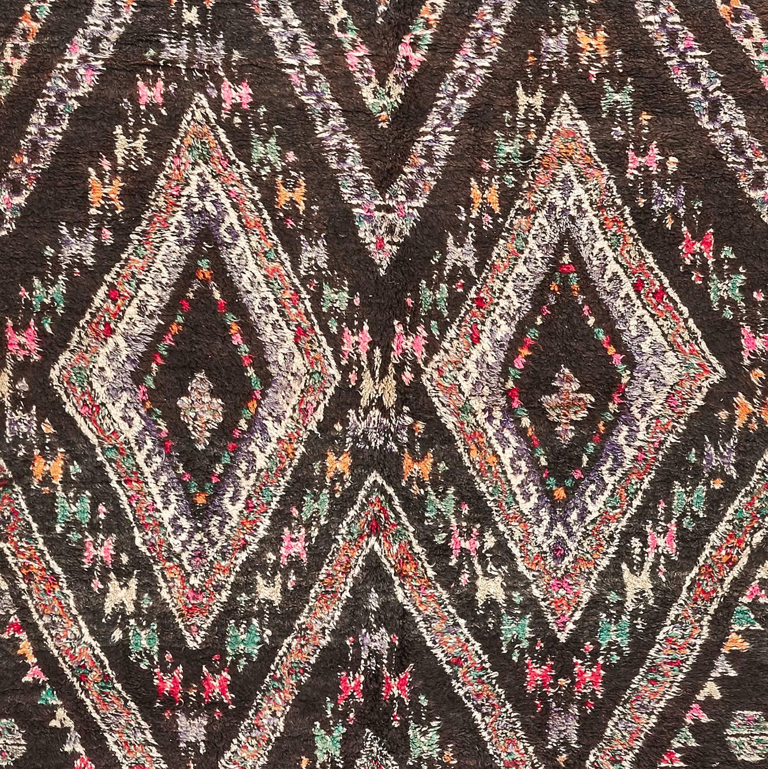 Individually selected by Madeline during her travels, these timeless carpets have been made in the Atlas mountains of Morocco by the Beni Ourain and Berber tribes. This rug is from Ait Seghrouchène. Hand-knotted with hand-spun wool. 100% wool.